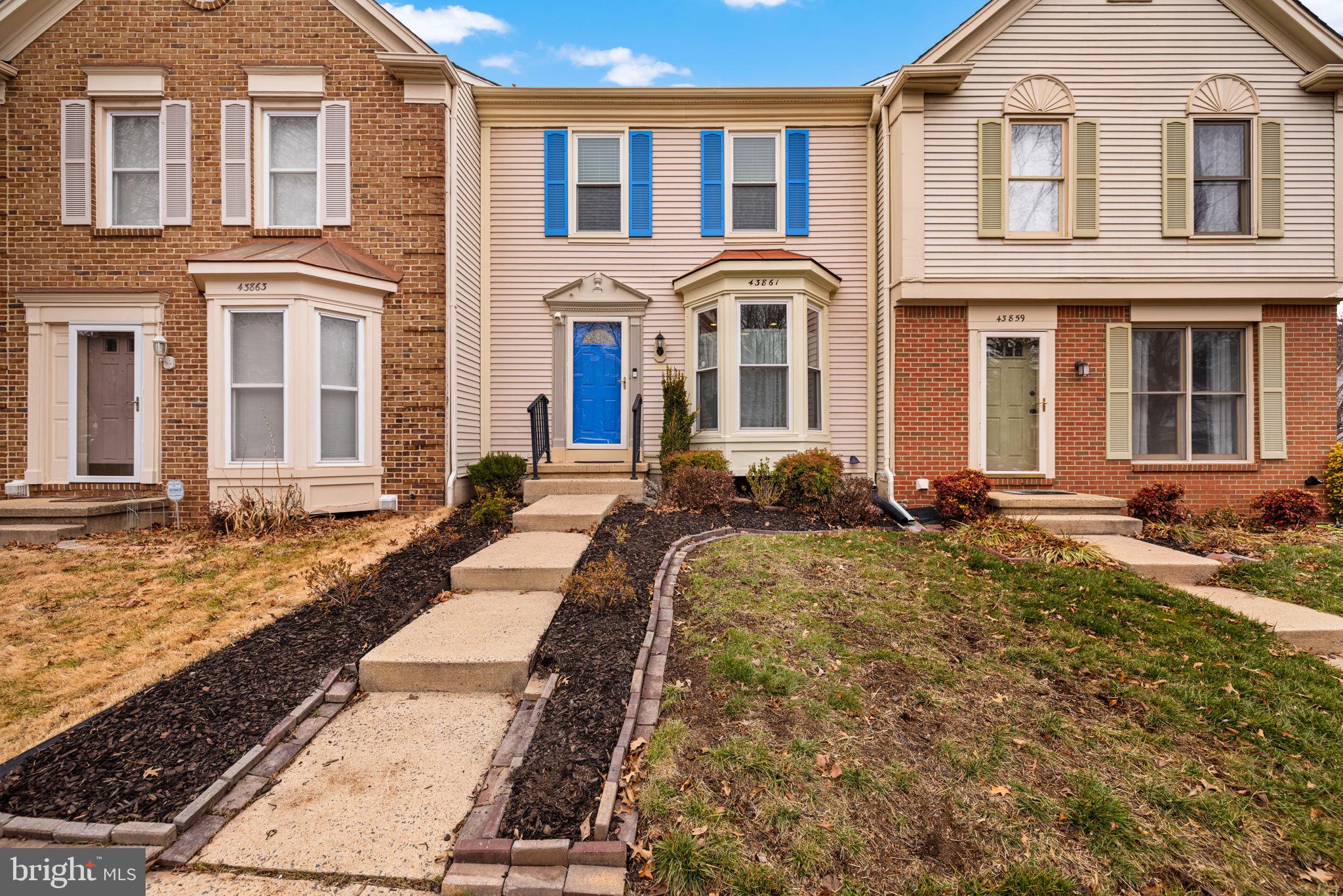 43861 Laburnum Square Ashburn, VA 20147 - Photo 2 of 46 a front view of a house with a yard