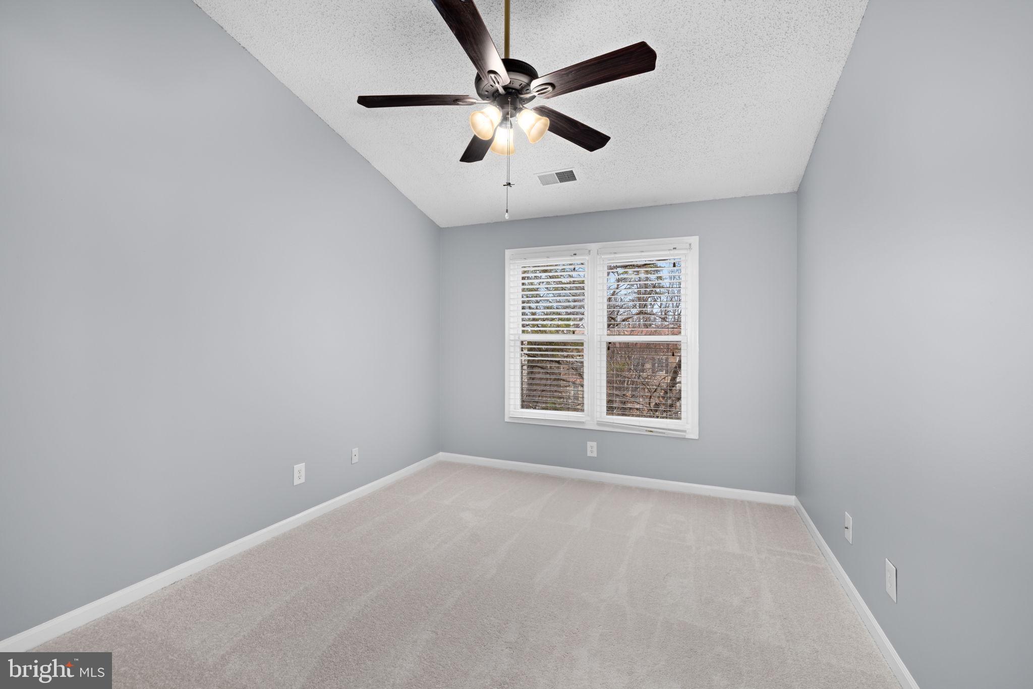43861 Laburnum Square Ashburn, VA 20147 - Photo 21 of 46 an empty room with a window and a fan
