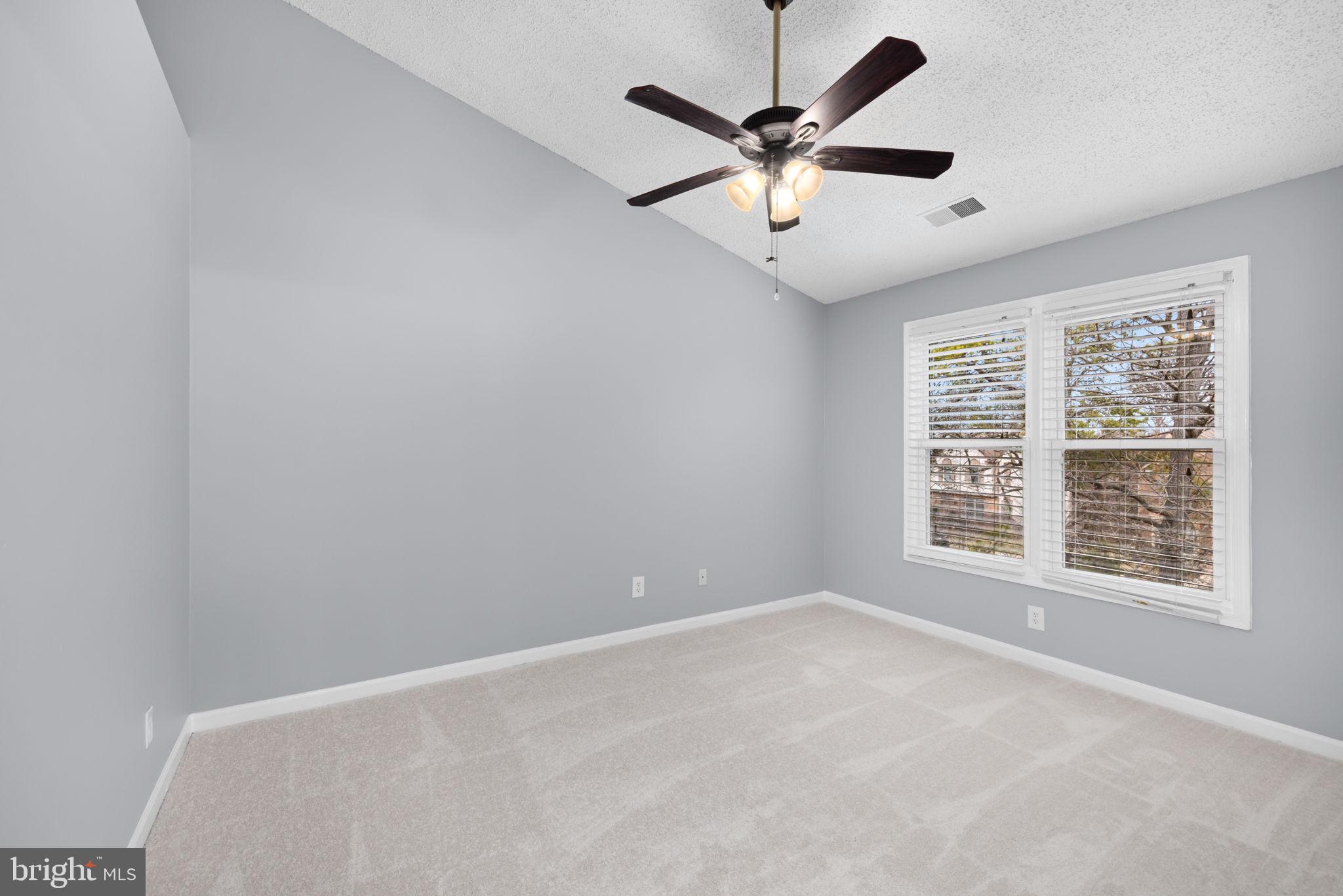 43861 Laburnum Square Ashburn, VA 20147 - Photo 22 of 46 an empty room with a window and a fan