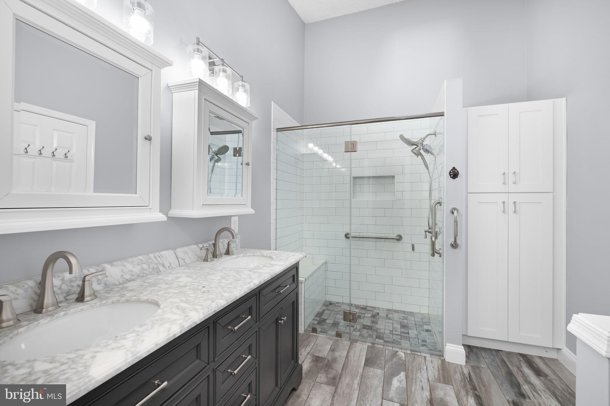 43861 Laburnum Square Ashburn, VA 20147 - Photo 25 of 46 a bathroom with a granite countertop sink toilet and shower