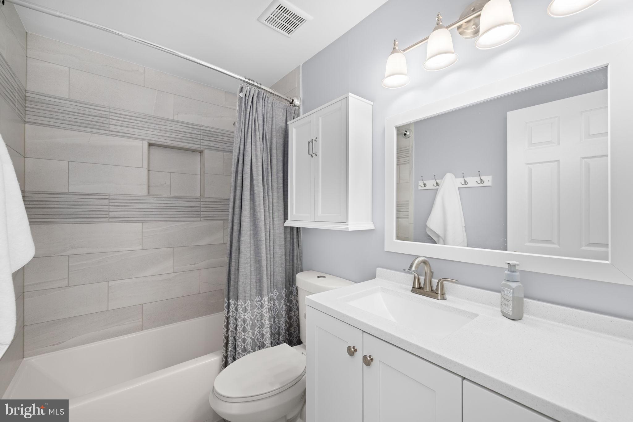 43861 Laburnum Square Ashburn, VA 20147 - Photo 31 of 46 a bathroom with a sink a toilet and shower