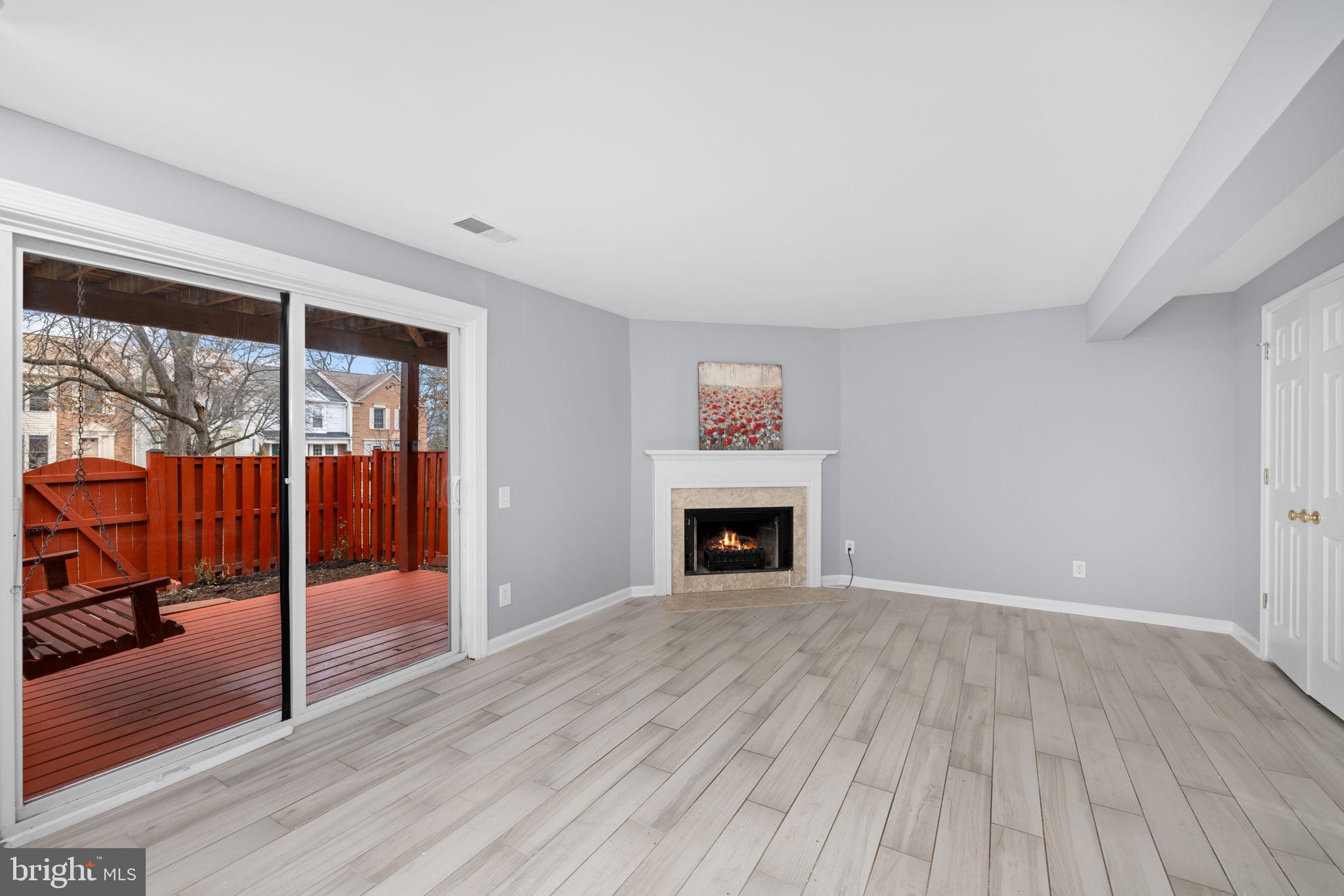 43861 Laburnum Square Ashburn, VA 20147 - Photo 36 of 46 a view of an empty room with wooden floor and a window