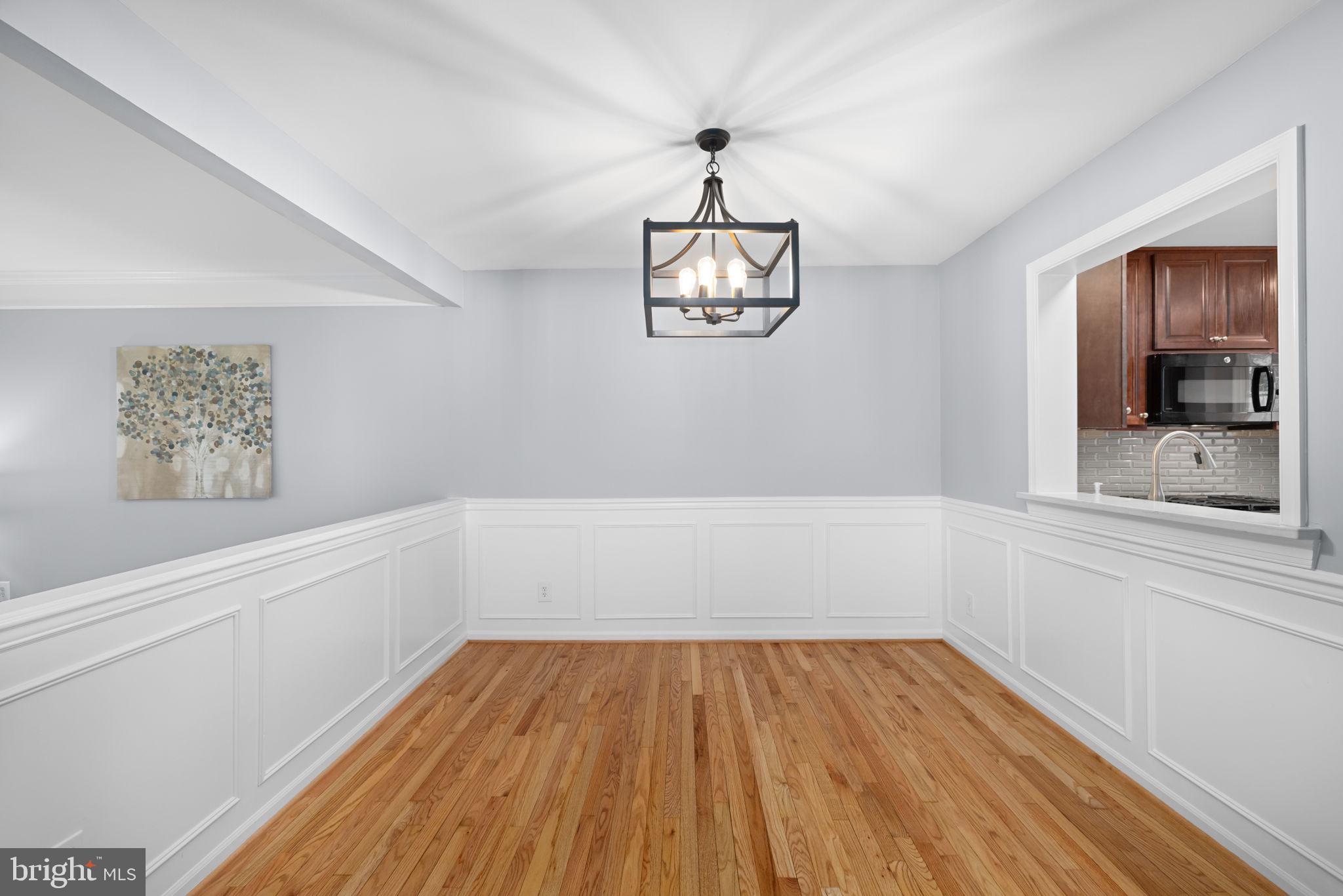 43861 Laburnum Square Ashburn, VA 20147 - Photo 7 of 46 wooden floor in an empty room with a window