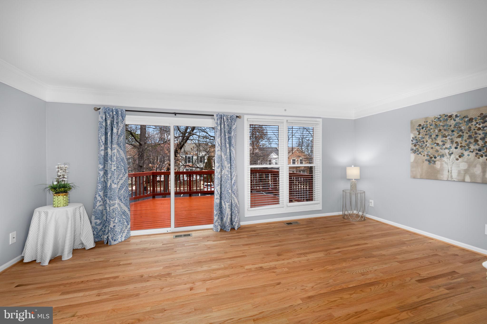43861 Laburnum Square Ashburn, VA 20147 - Photo 8 of 46 a view of an empty room with wooden floor and a window