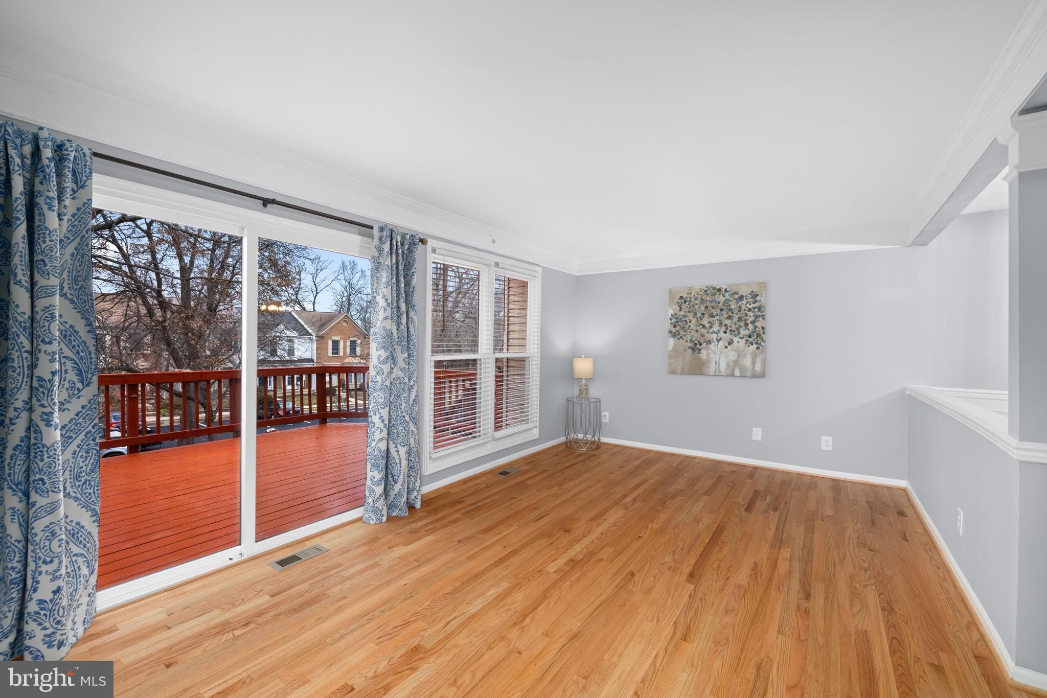 43861 Laburnum Square Ashburn, VA 20147 - Photo 10 of 46 wooden floor in an empty room with a window
