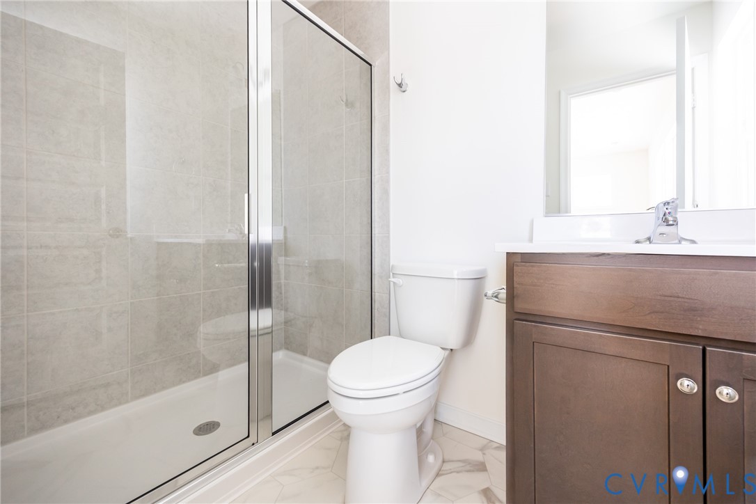 239 Greenpark Road Sandston, VA 23150 - Photo 15 of 31 a bathroom with a granite countertop sink toilet and shower