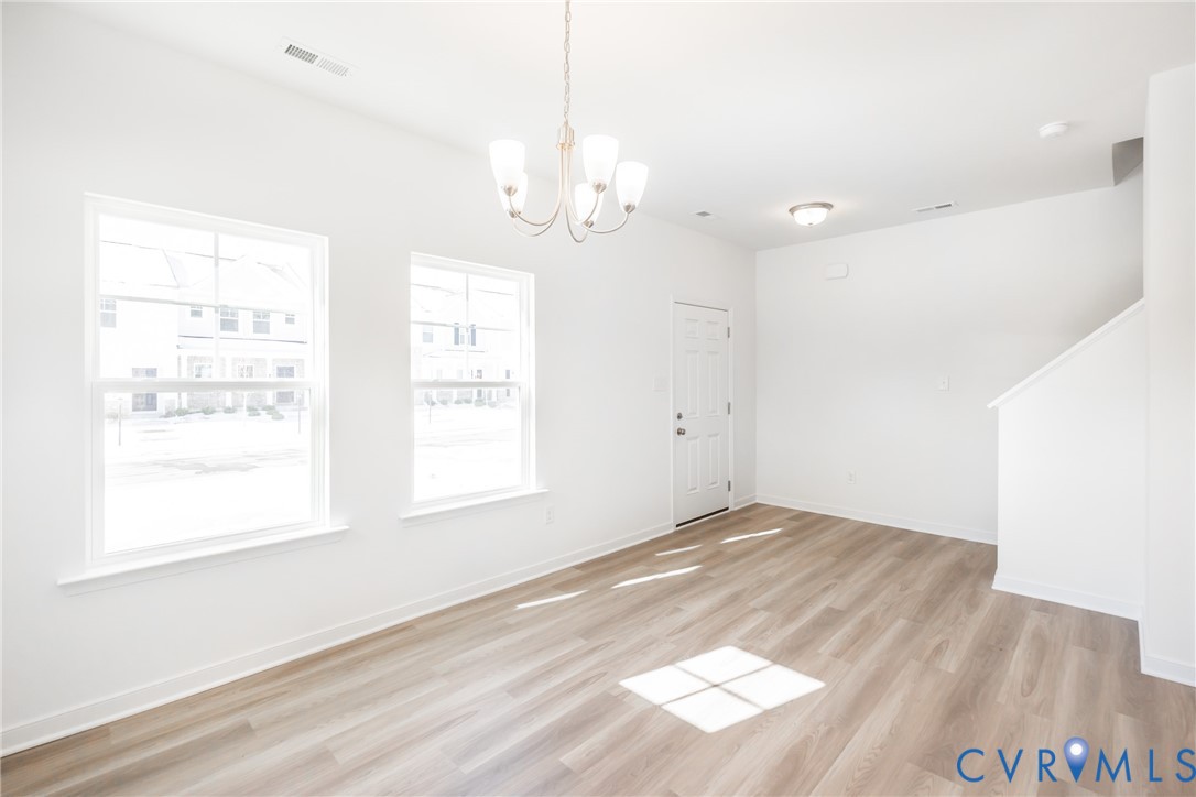 239 Greenpark Road Sandston, VA 23150 - Photo 3 of 31 a view of empty room with wooden floor and fan