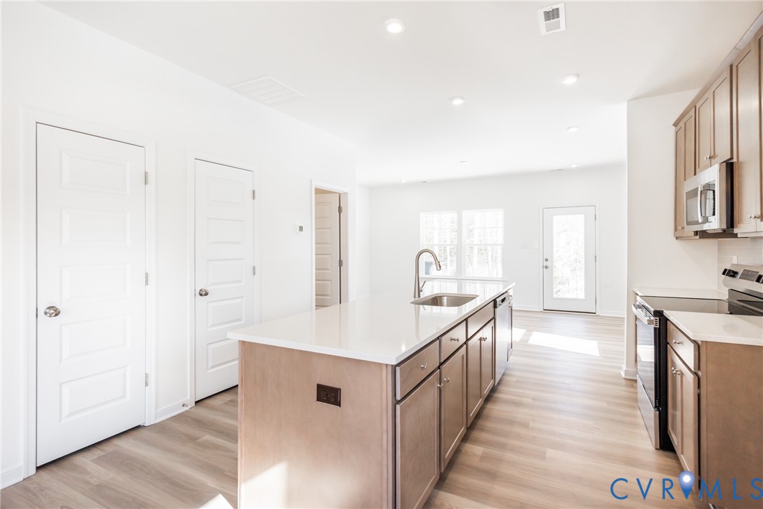 239 Greenpark Road Sandston, VA 23150 - Photo 4 of 31 a kitchen with counter top space and sink