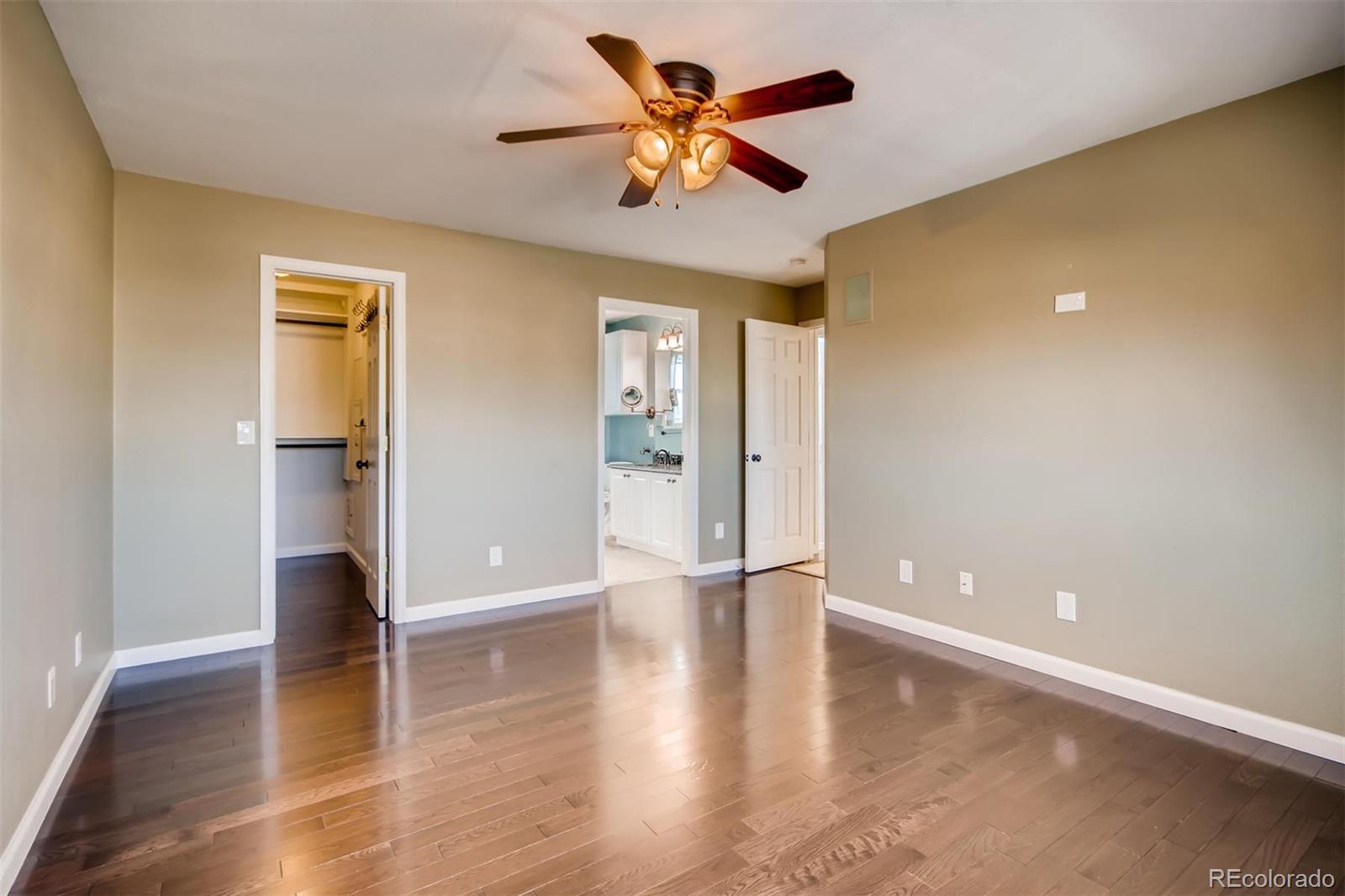 1518 Spring Water Way Highlands Ranch, CO 80129 - Photo 15 of 26 a view of an empty room with window and wooden floor