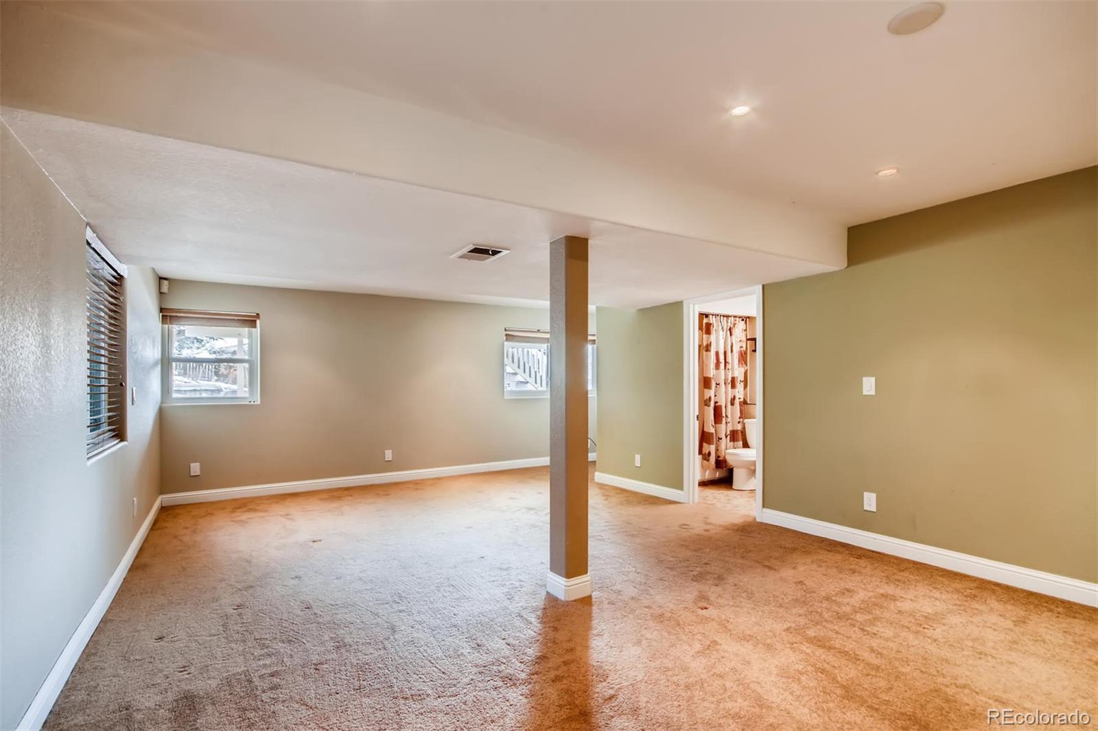 1518 Spring Water Way Highlands Ranch, CO 80129 - Photo 20 of 26 a view of a livingroom with an empty room