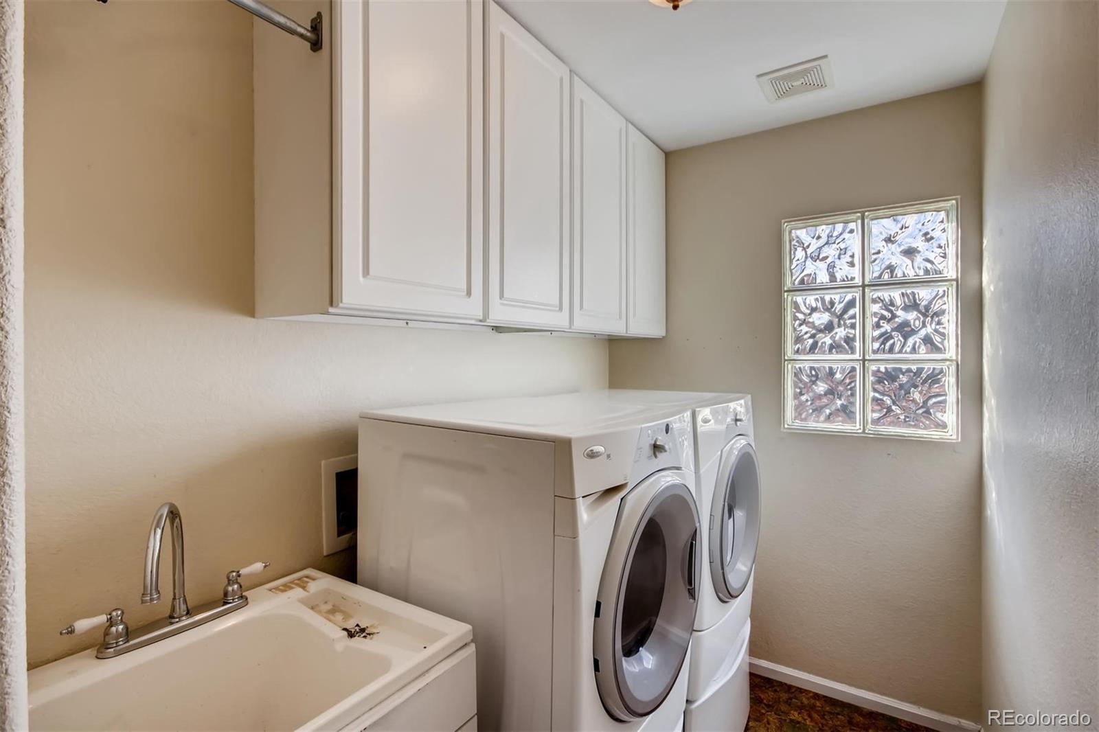 1518 Spring Water Way Highlands Ranch, CO 80129 - Photo 23 of 26 a utility room with dryer and washer