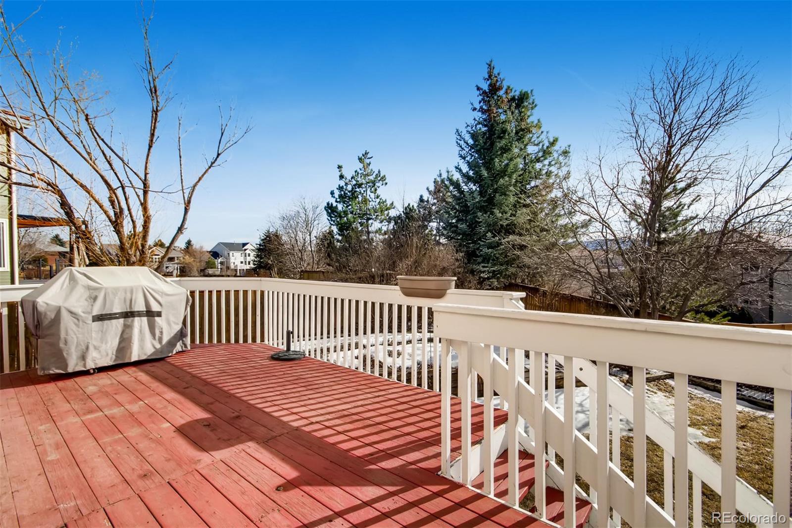 1518 Spring Water Way Highlands Ranch, CO 80129 - Photo 24 of 26 a balcony with wooden floor