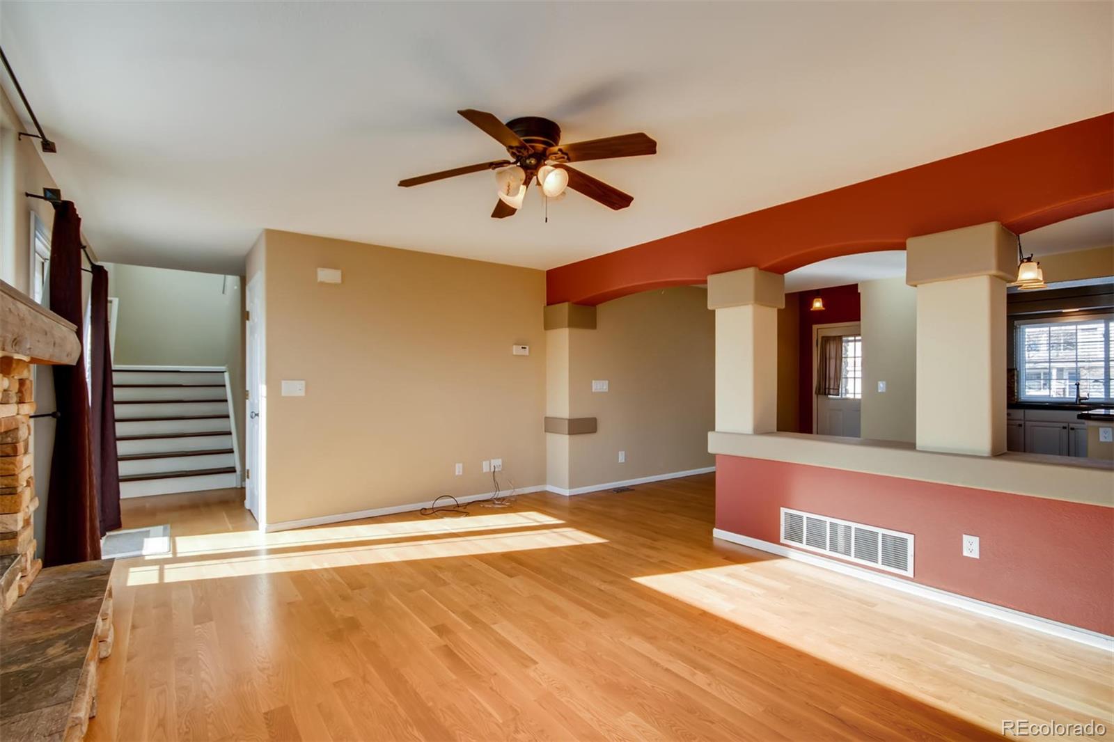 1518 Spring Water Way Highlands Ranch, CO 80129 - Photo 5 of 26 a view of a livingroom with a staircase