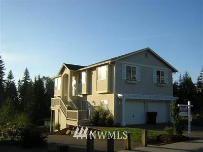 6 167th Street Southwest Bothell, WA 98012 - Photo 1 of 1 a front view of a house with garden