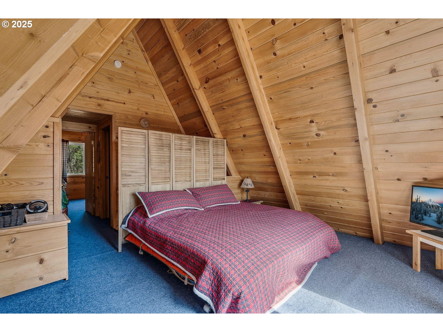 143970 Highway 97 Gilchrist, OR 97737 - Photo 11 of 30 a bedroom with a bed and a view of the wall