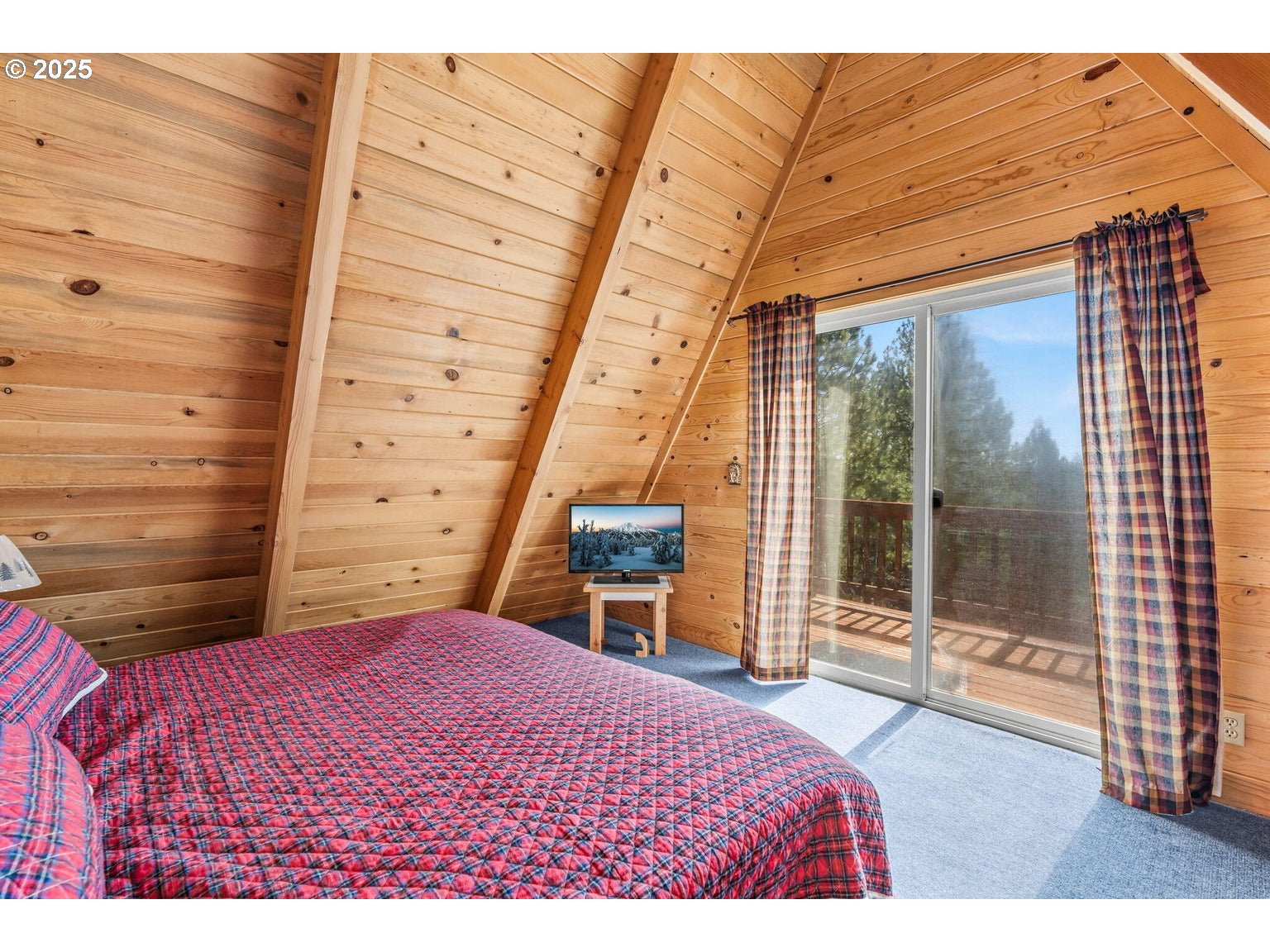 143970 Highway 97 Gilchrist, OR 97737 - Photo 12 of 30 a bedroom with a bed and a dresser