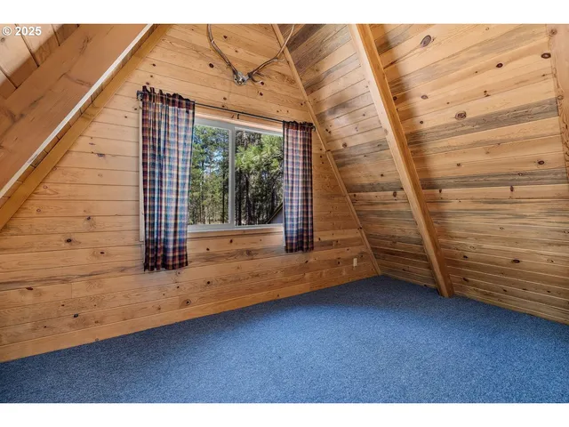 a view of a room with wooden walls