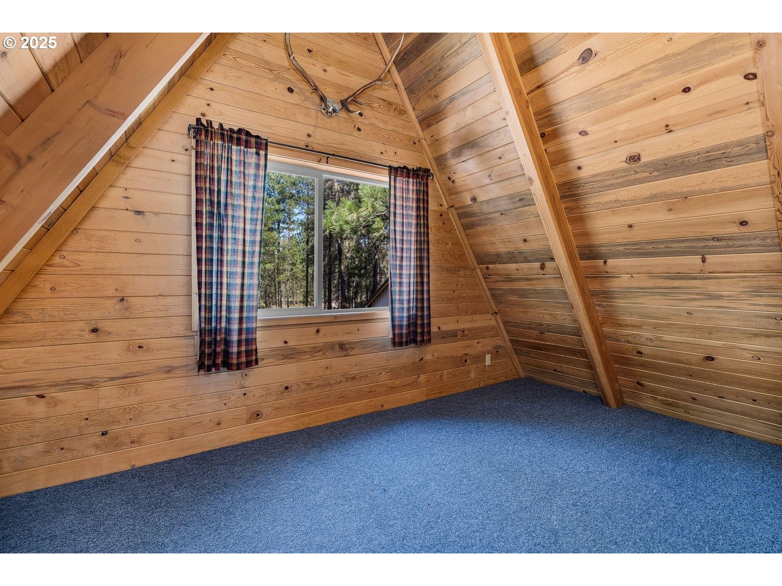 143970 Highway 97 Gilchrist, OR 97737 - Photo 15 of 30 a view of a room with wooden walls