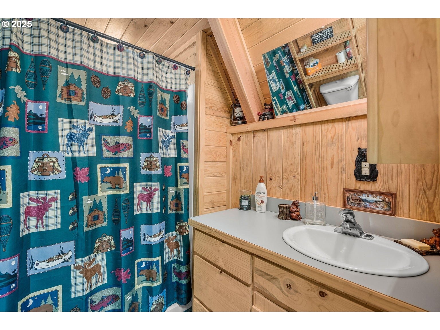 143970 Highway 97 Gilchrist, OR 97737 - Photo 16 of 30 a bathroom with a sink and a mirror