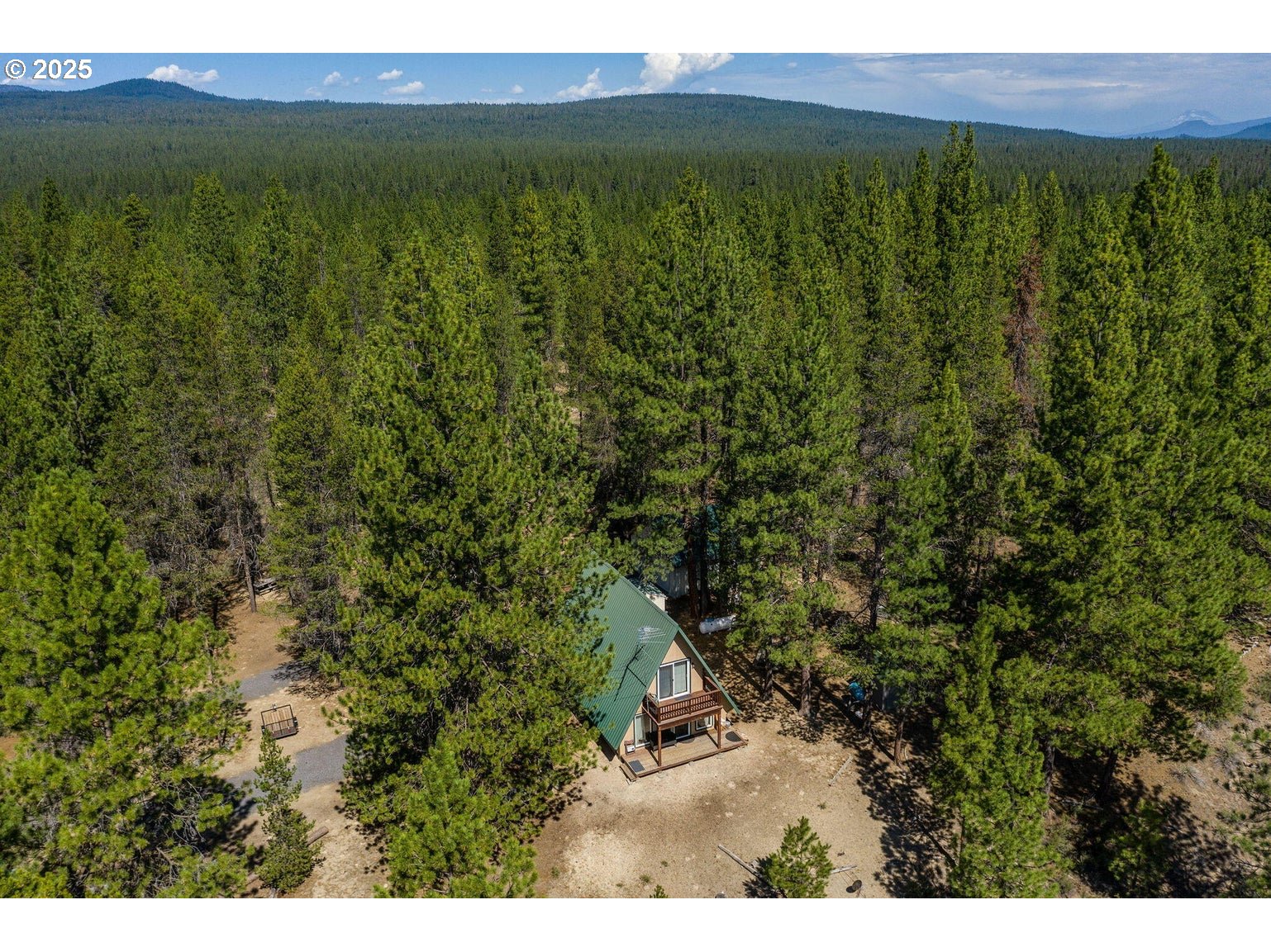 143970 Highway 97 Gilchrist, OR 97737 - Photo 2 of 30 a view of a yard with an outdoor space