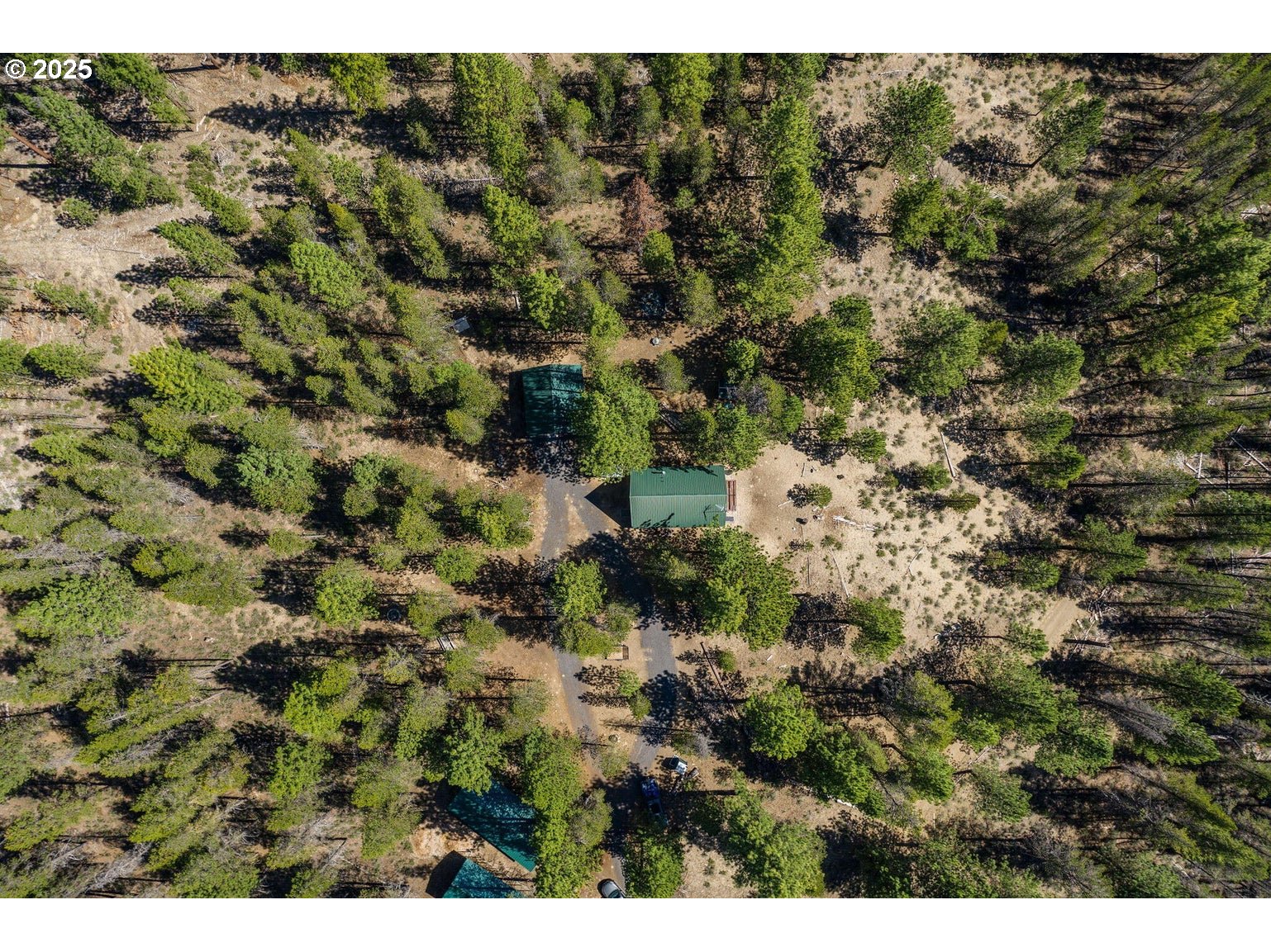 143970 Highway 97 Gilchrist, OR 97737 - Photo 25 of 30 a view of a house with a tree