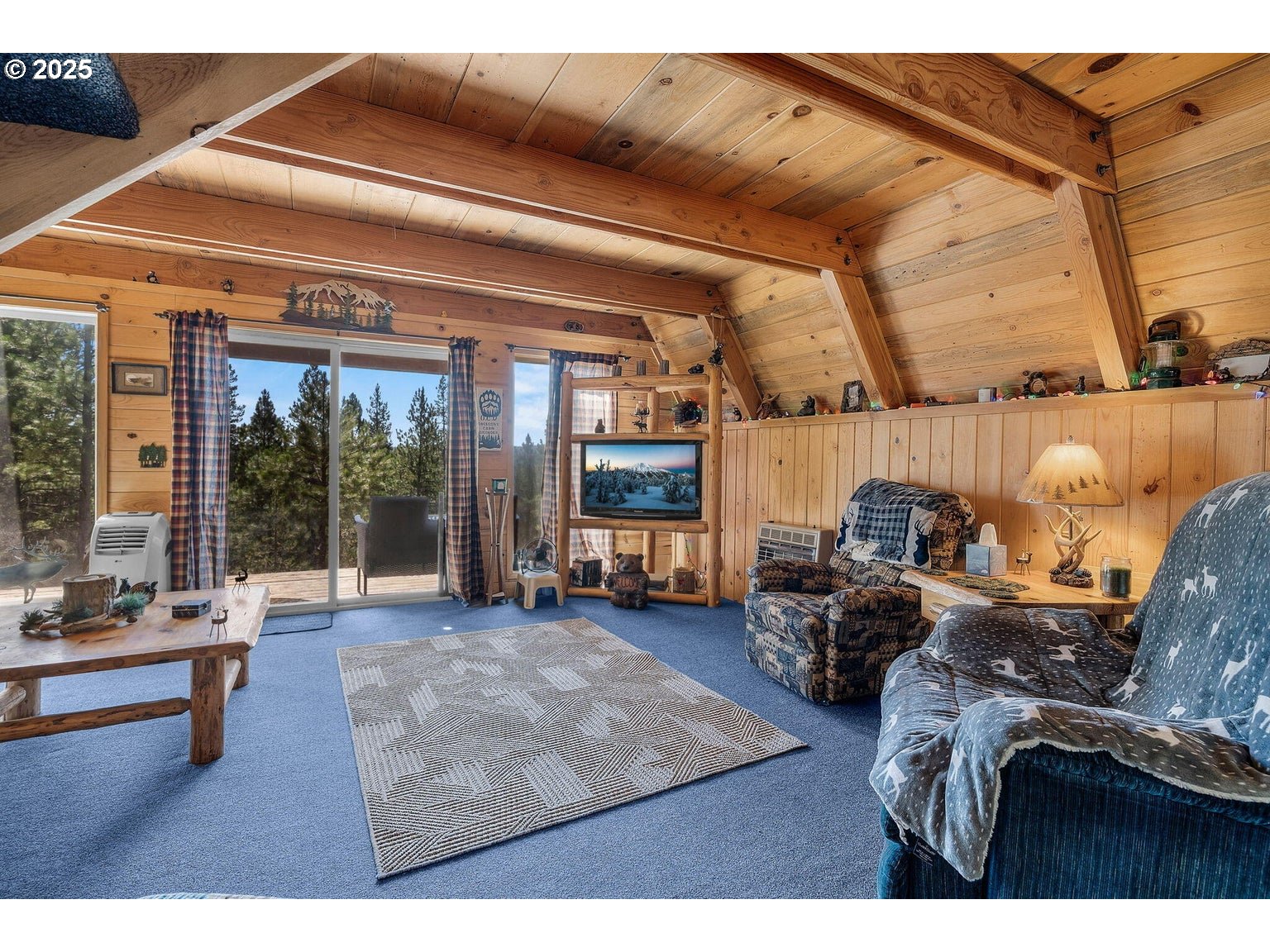 143970 Highway 97 Gilchrist, OR 97737 - Photo 5 of 30 a living room with furniture and large window