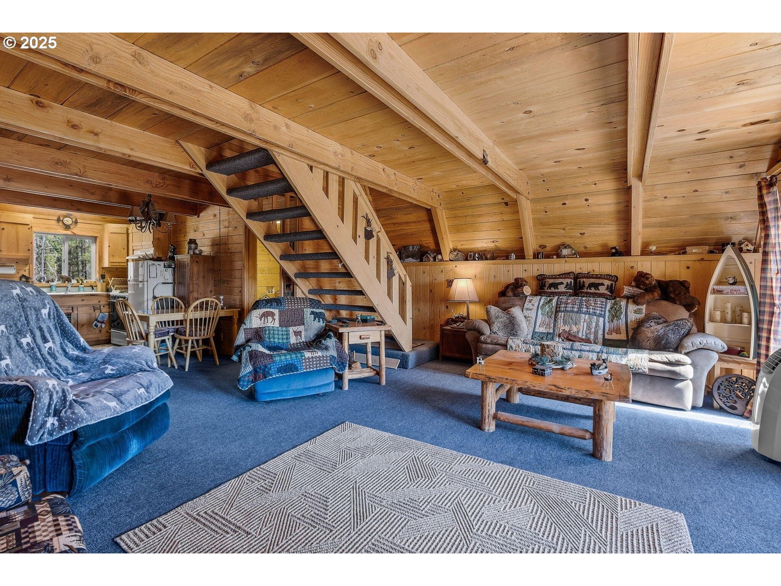 143970 Highway 97 Gilchrist, OR 97737 - Photo 7 of 30 a living room with furniture and a wooden floor