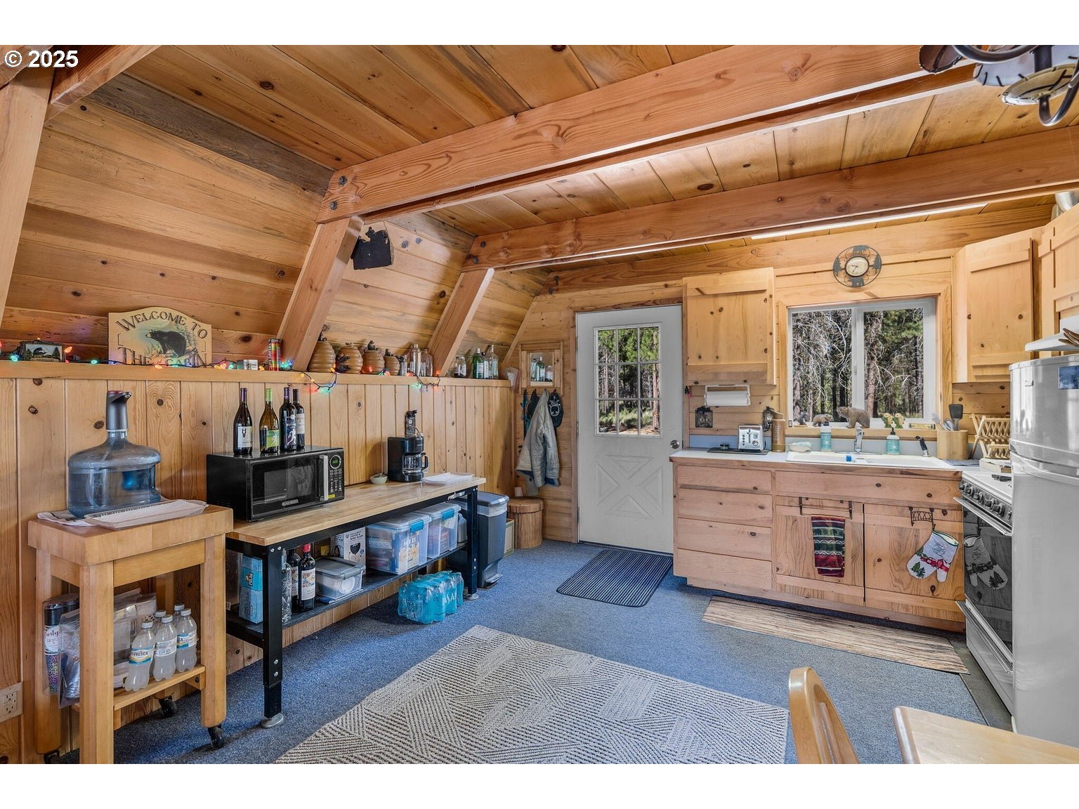 143970 Highway 97 Gilchrist, OR 97737 - Photo 9 of 30 a living room with stainless steel appliances kitchen island granite countertop lots of clutter and stainless steel appliances
