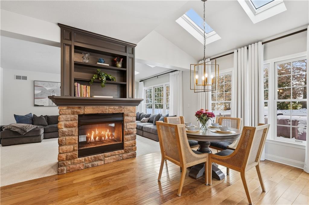 2017 Condor Lane Gibsonia, PA 15044 - Photo 20 of 49 a dining room with furniture and a fireplace