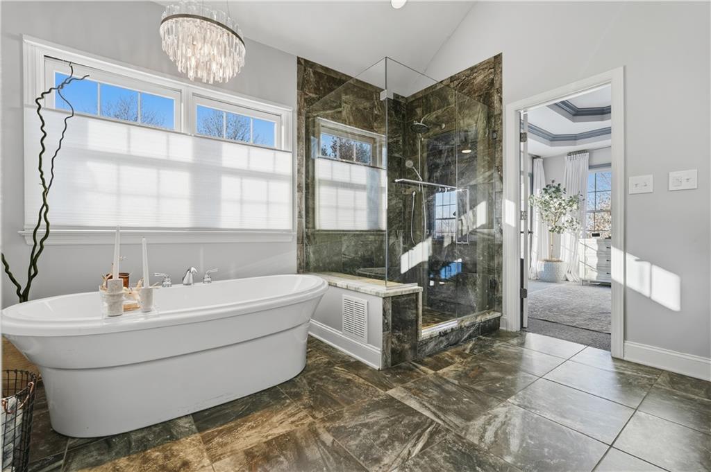 2017 Condor Lane Gibsonia, PA 15044 - Photo 29 of 49 a bathroom with a bathtub and a shower