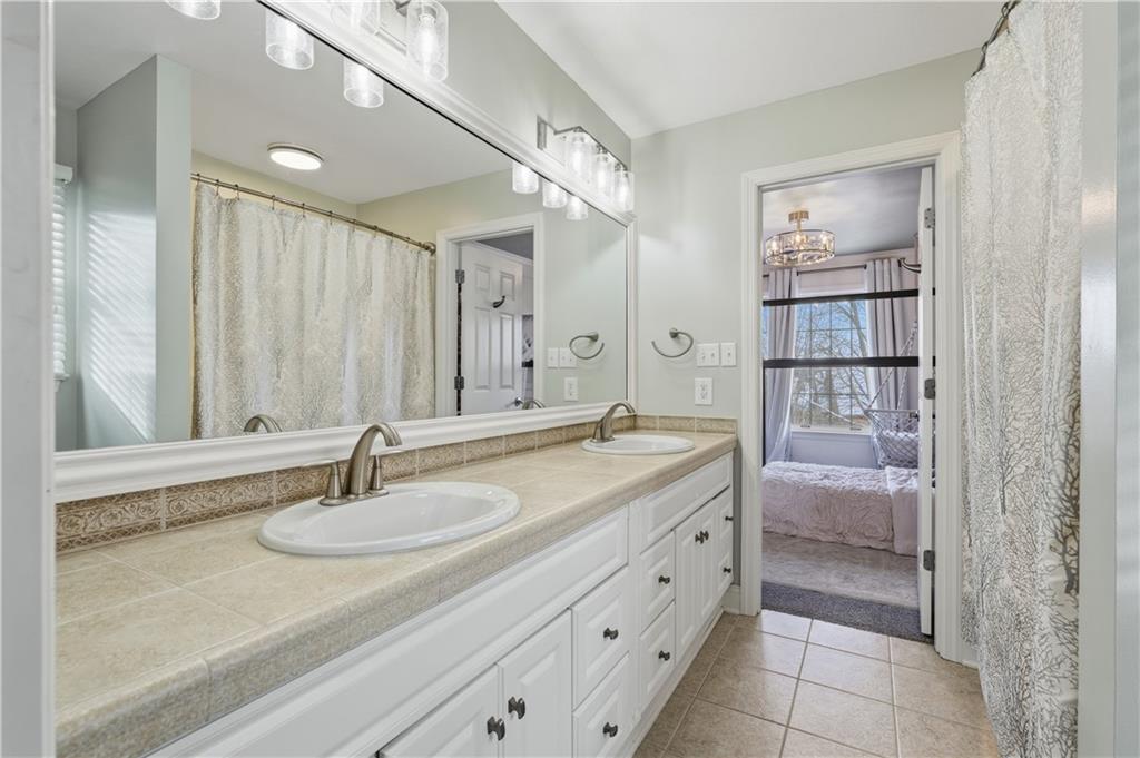 2017 Condor Lane Gibsonia, PA 15044 - Photo 35 of 49 a bathroom with a granite countertop sink and a mirror