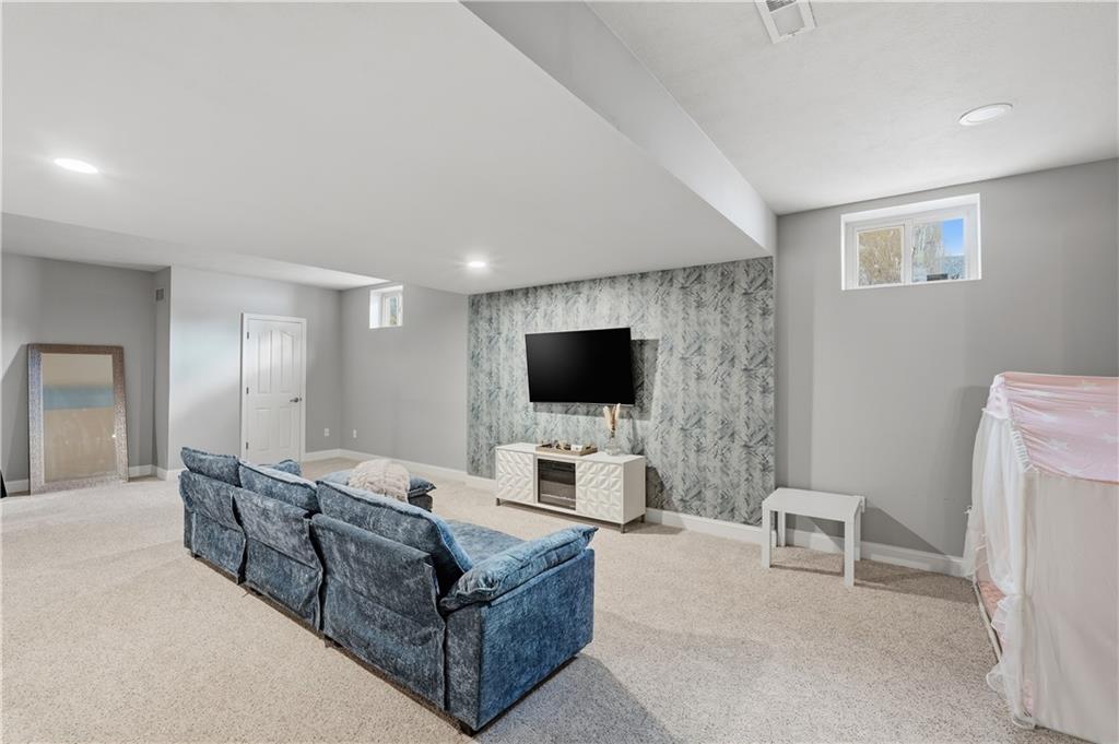 2017 Condor Lane Gibsonia, PA 15044 - Photo 39 of 49 a living room with furniture and a flat screen tv