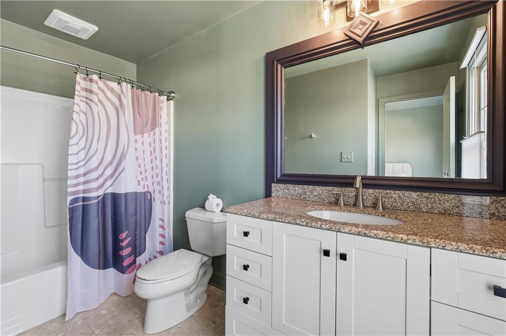 2017 Condor Lane Gibsonia, PA 15044 - Photo 40 of 49 a bathroom with a granite countertop toilet sink and mirror