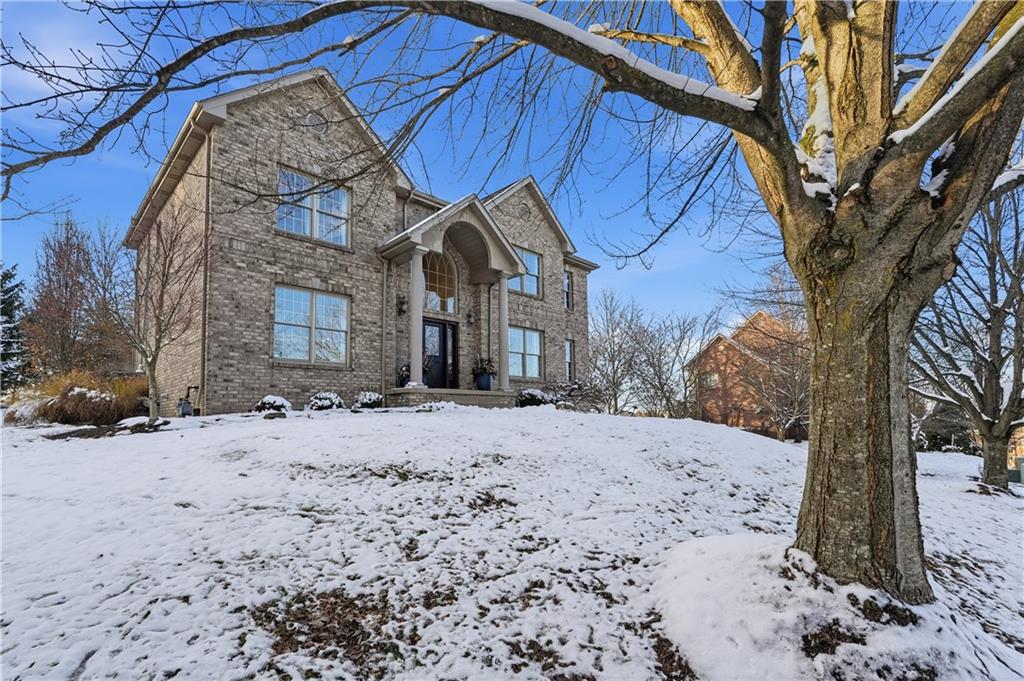 2017 Condor Lane Gibsonia, PA 15044 - Photo 42 of 49 a front view of a house with a yard covered in snow