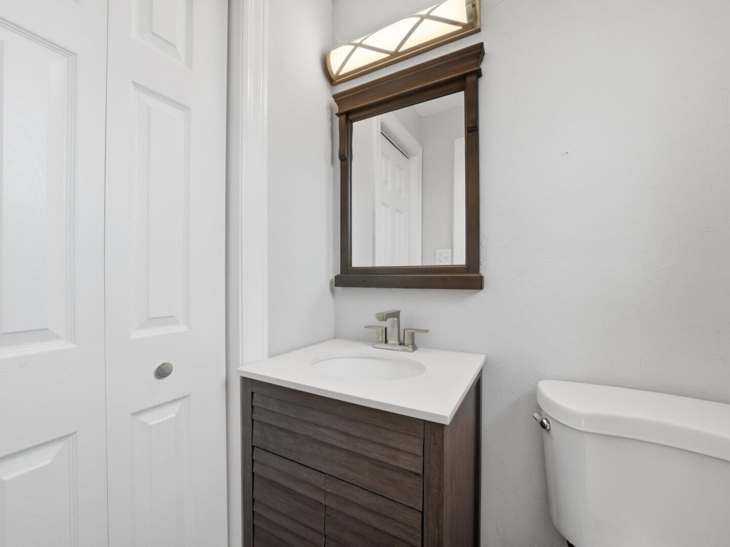 18441 Marshfield Avenue Homewood, IL 60430 - Photo 16 of 49 a bathroom with a toilet sink and mirror