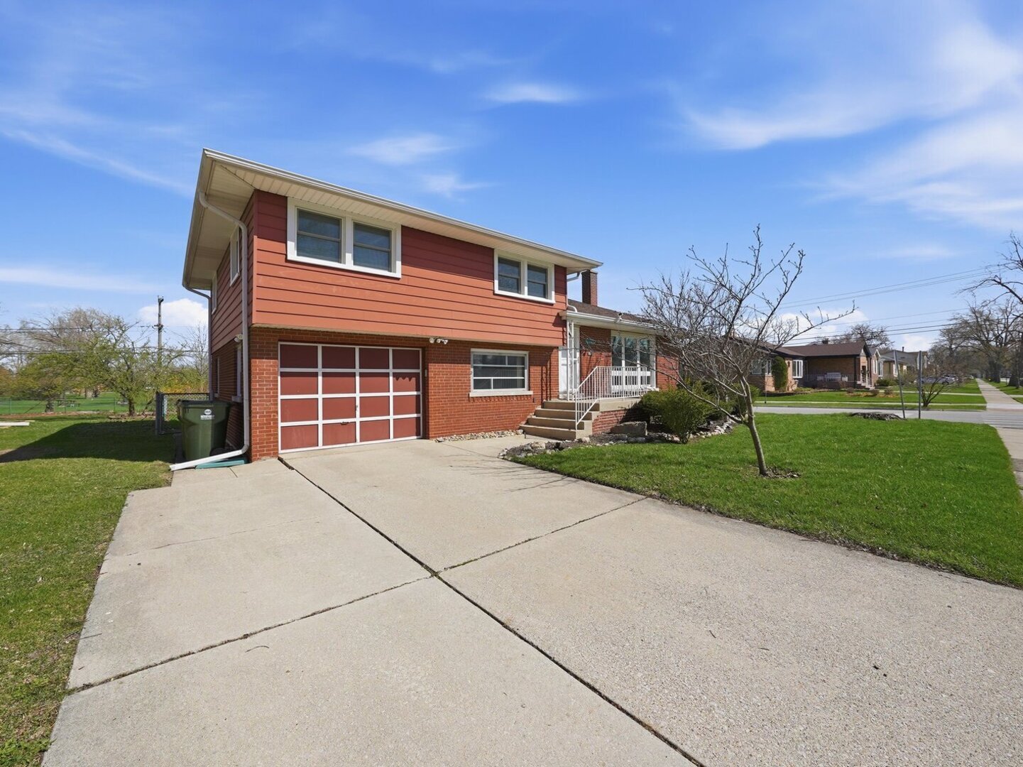 18441 Marshfield Avenue Homewood, IL 60430 - Photo 2 of 49 a front view of a house with a yard