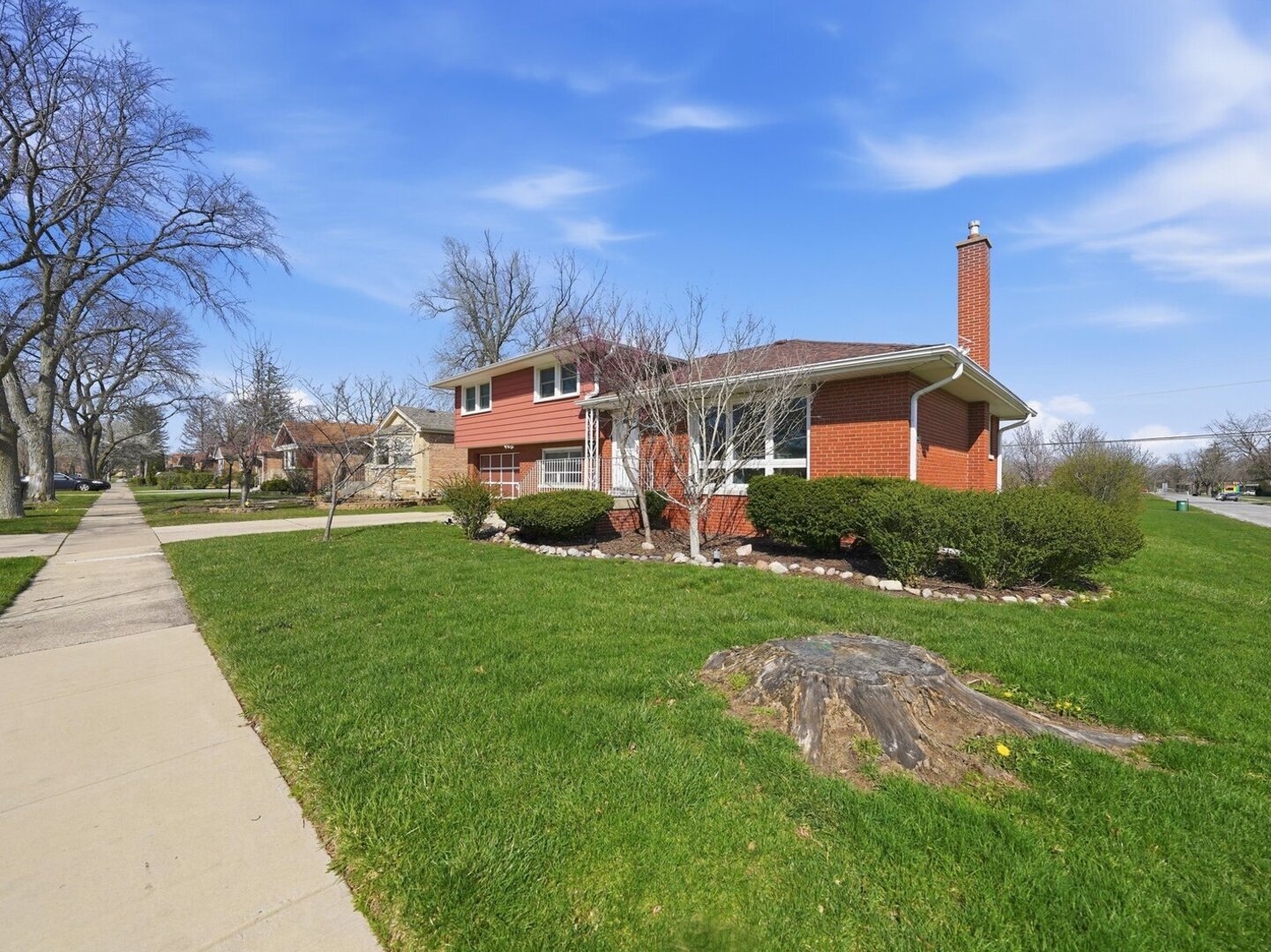 18441 Marshfield Avenue Homewood, IL 60430 - Photo 3 of 49 a front view of a house with a yard