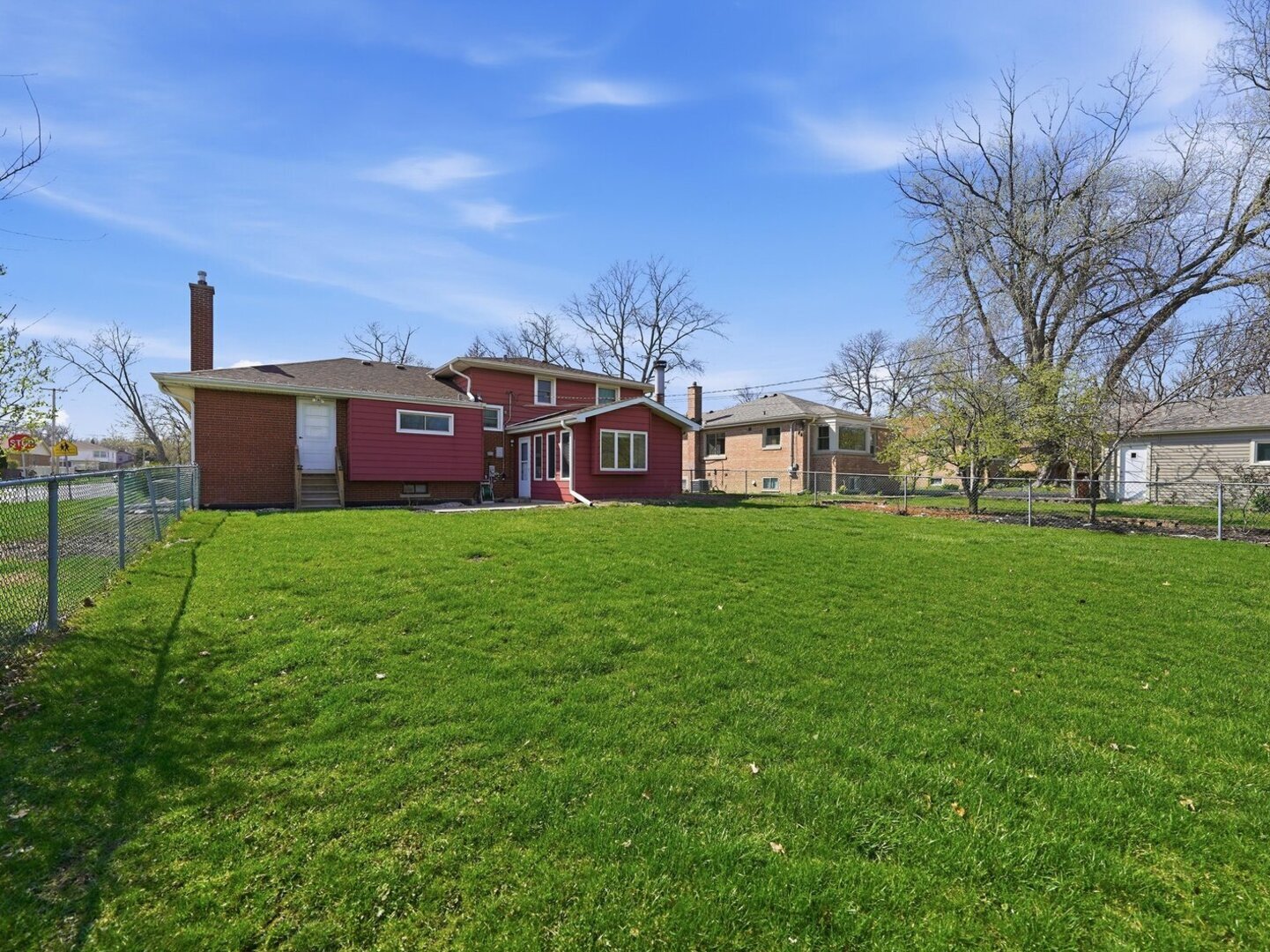 18441 Marshfield Avenue Homewood, IL 60430 - Photo 43 of 49 a view of a house with a big yard