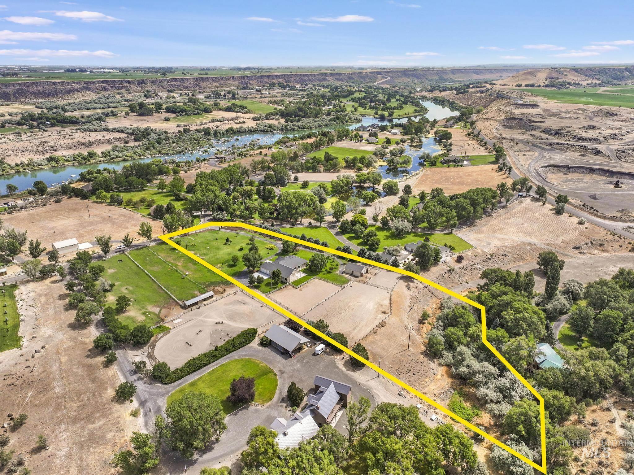 1301 Kanaka Rapids Road Buhl, ID 83316 - Photo 4 of 50 Expansive property featuring multiple structures, mature trees, open land, and a bordering river
