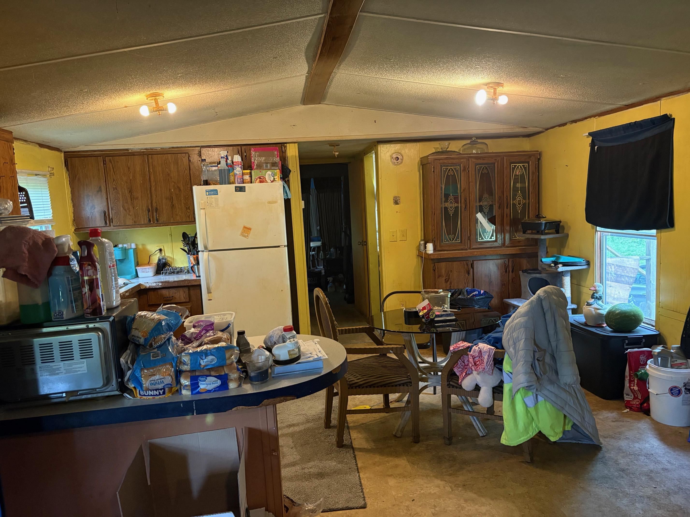 2667 Chambers Road Ripley, TN 38063 - Photo 5 of 14 a room with furniture a flat screen tv and a refrigerator