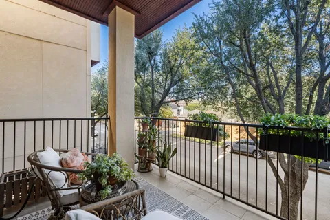 a view of balcony with furniture