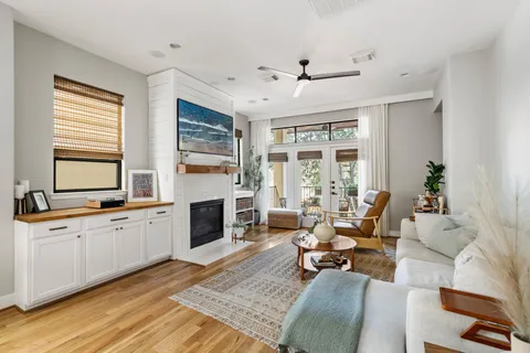 a living room with furniture fireplace and flat screen tv