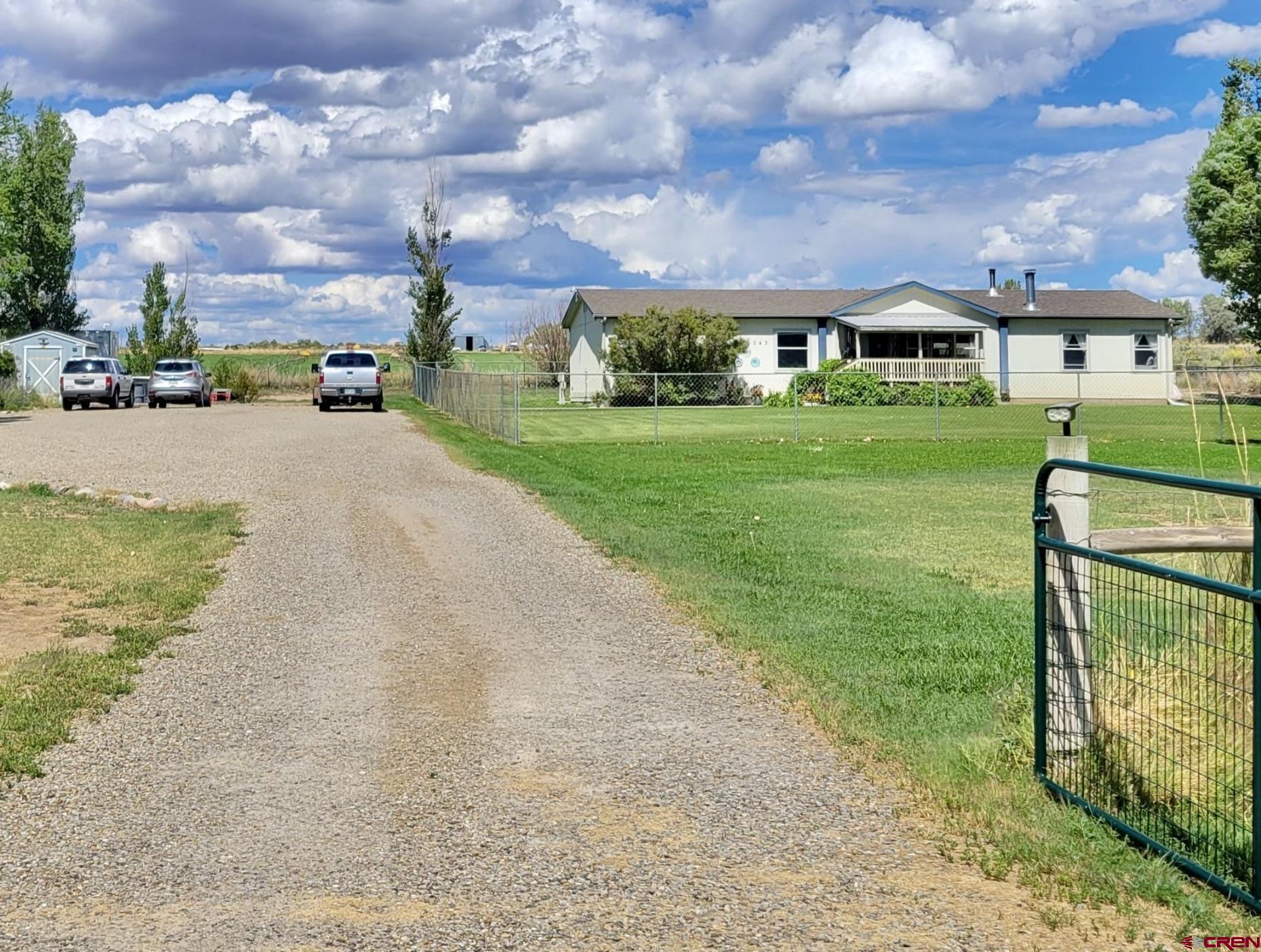 a view of house with yard