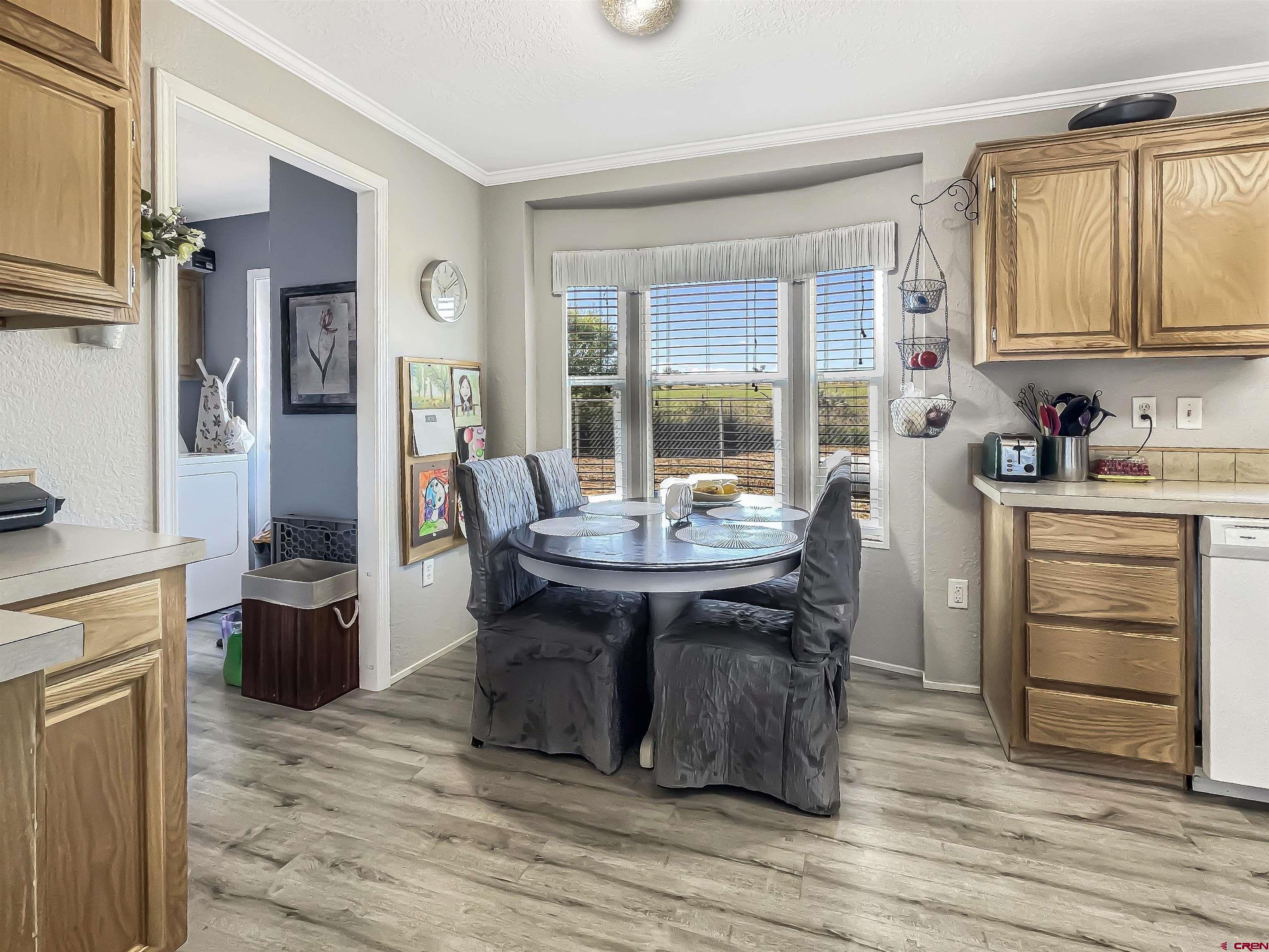 21043 Road C 7 Cortez Co 81321 Cortez, CO 81321 - Photo 11 of 40 a kitchen with a sink appliances and cabinets