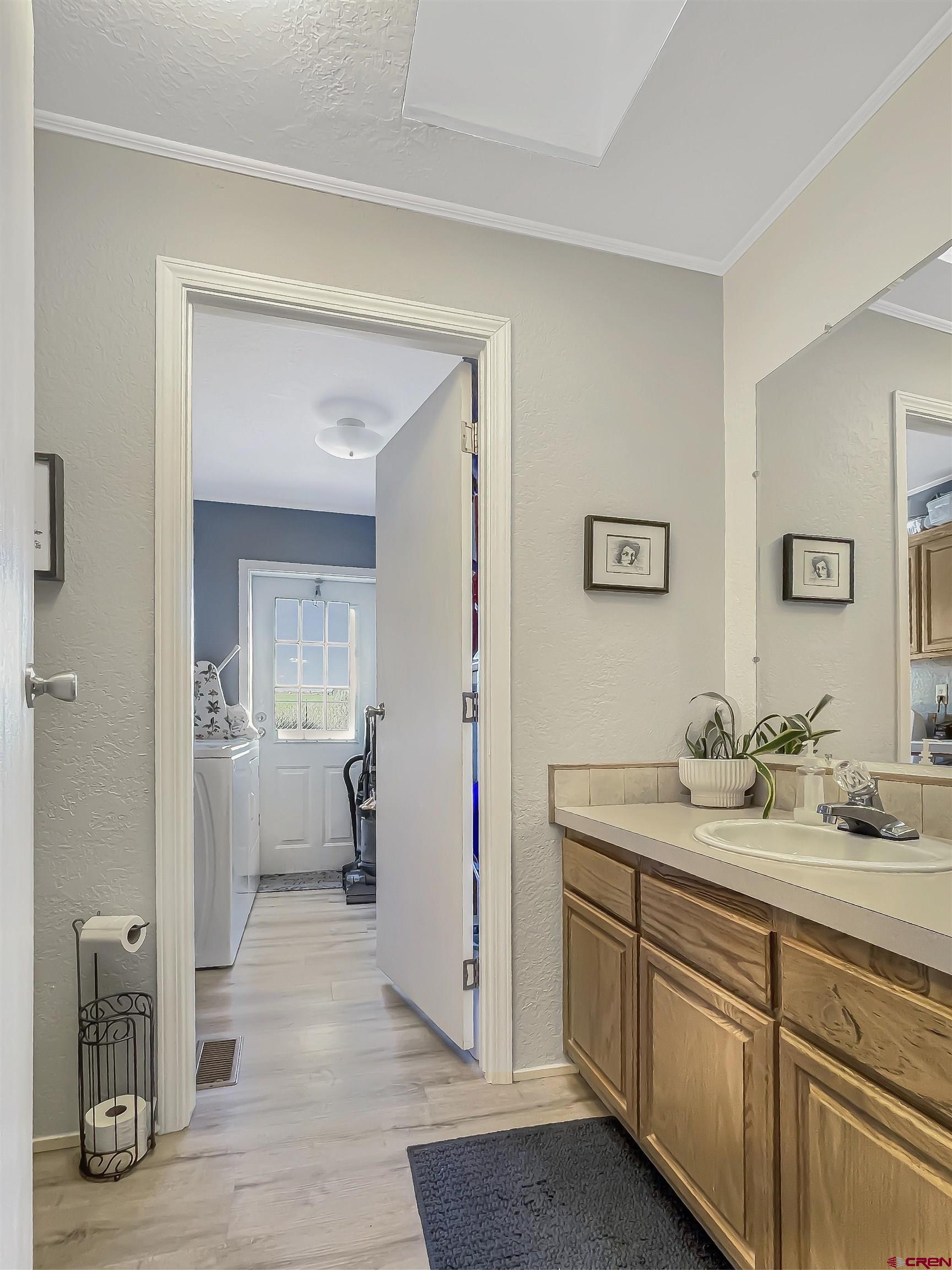 21043 Road C 7 Cortez Co 81321 Cortez, CO 81321 - Photo 12 of 40 a en suite bathroom with a granite countertop sink and a mirror