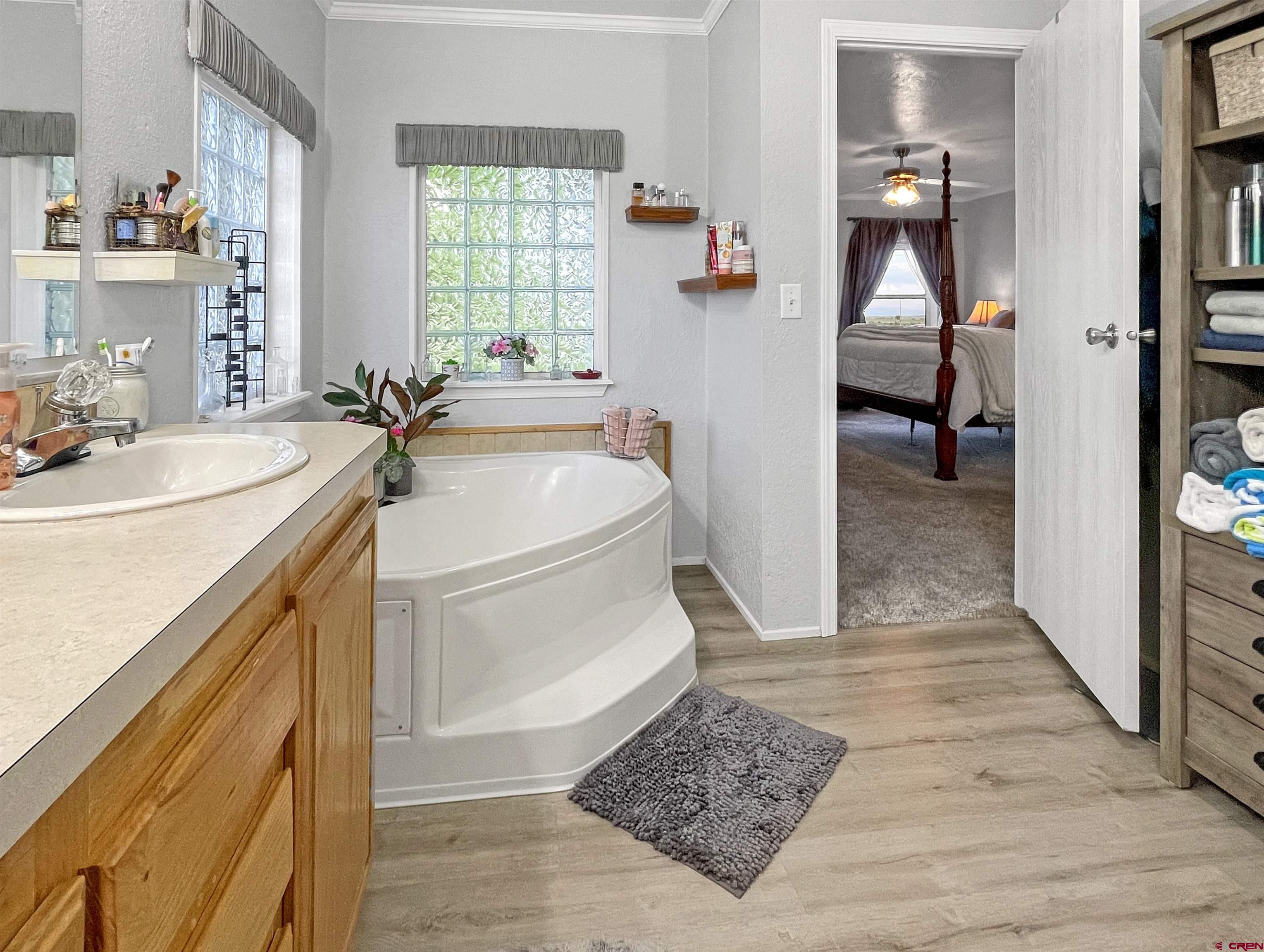 21043 Road C 7 Cortez Co 81321 Cortez, CO 81321 - Photo 17 of 40 a storage room with wooden floor washer and dryer