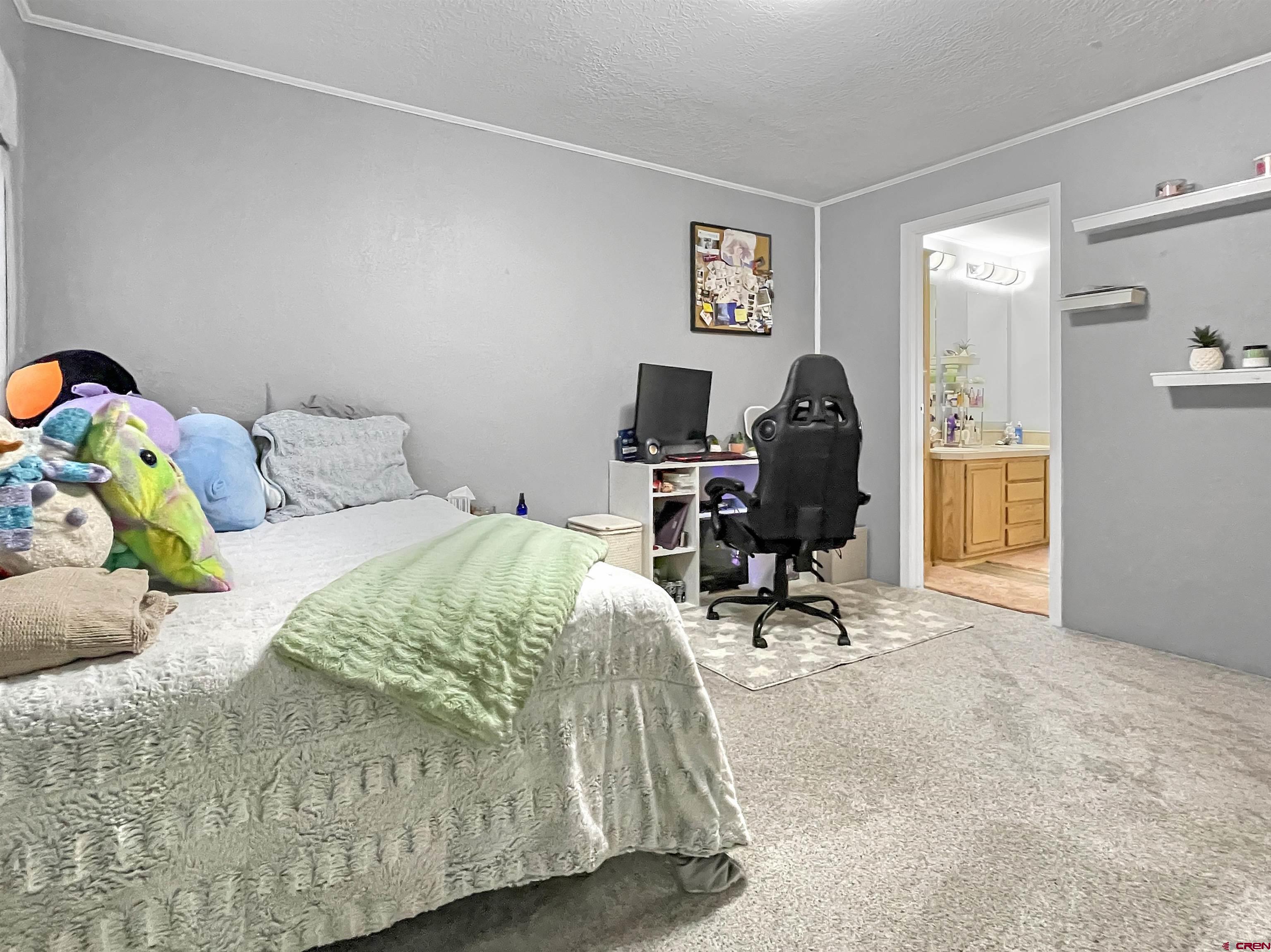 21043 Road C 7 Cortez Co 81321 Cortez, CO 81321 - Photo 20 of 40 a bedroom with a bed and a window