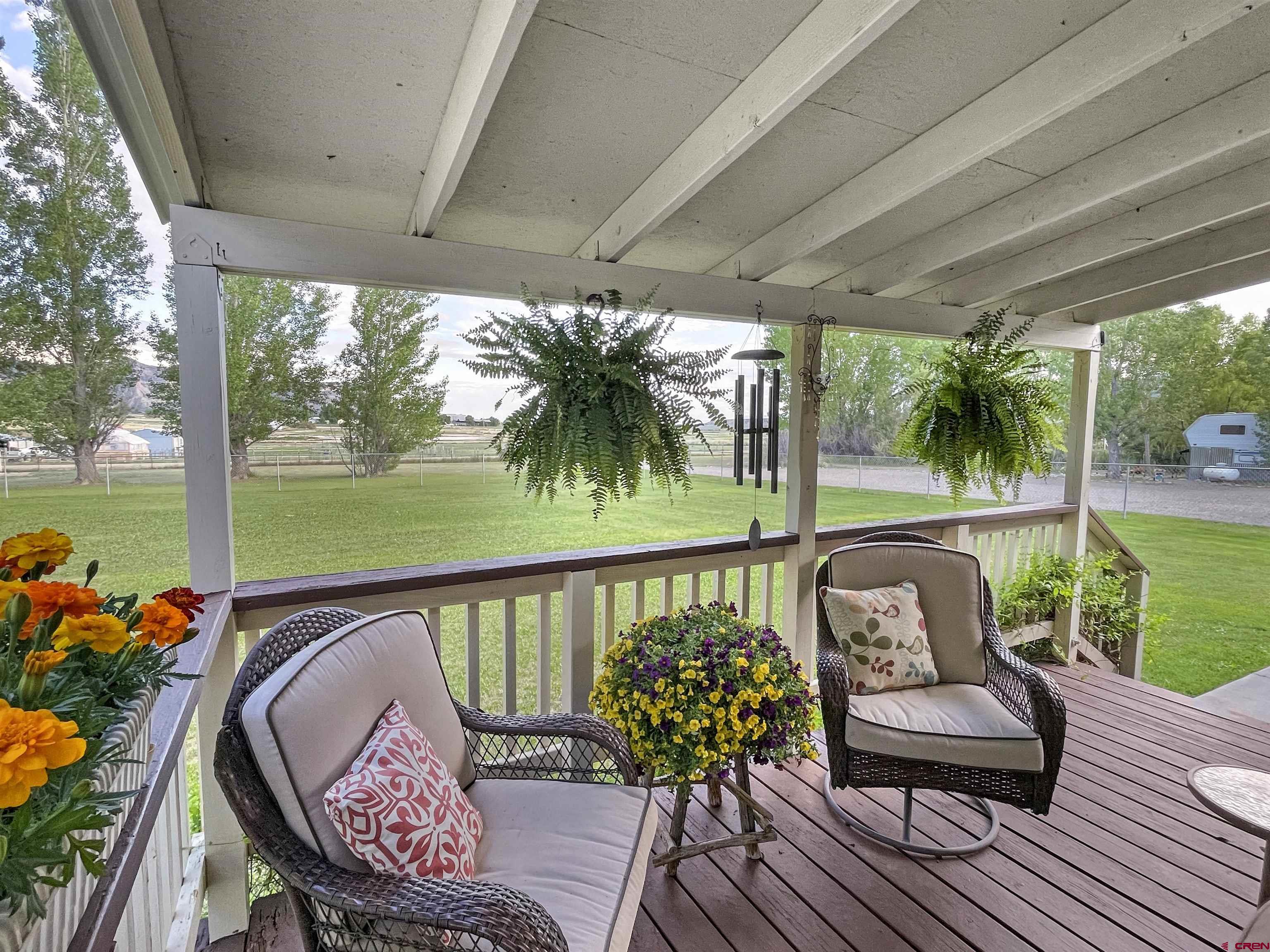21043 Road C 7 Cortez Co 81321 Cortez, CO 81321 - Photo 2 of 40 a balcony with wooden floor