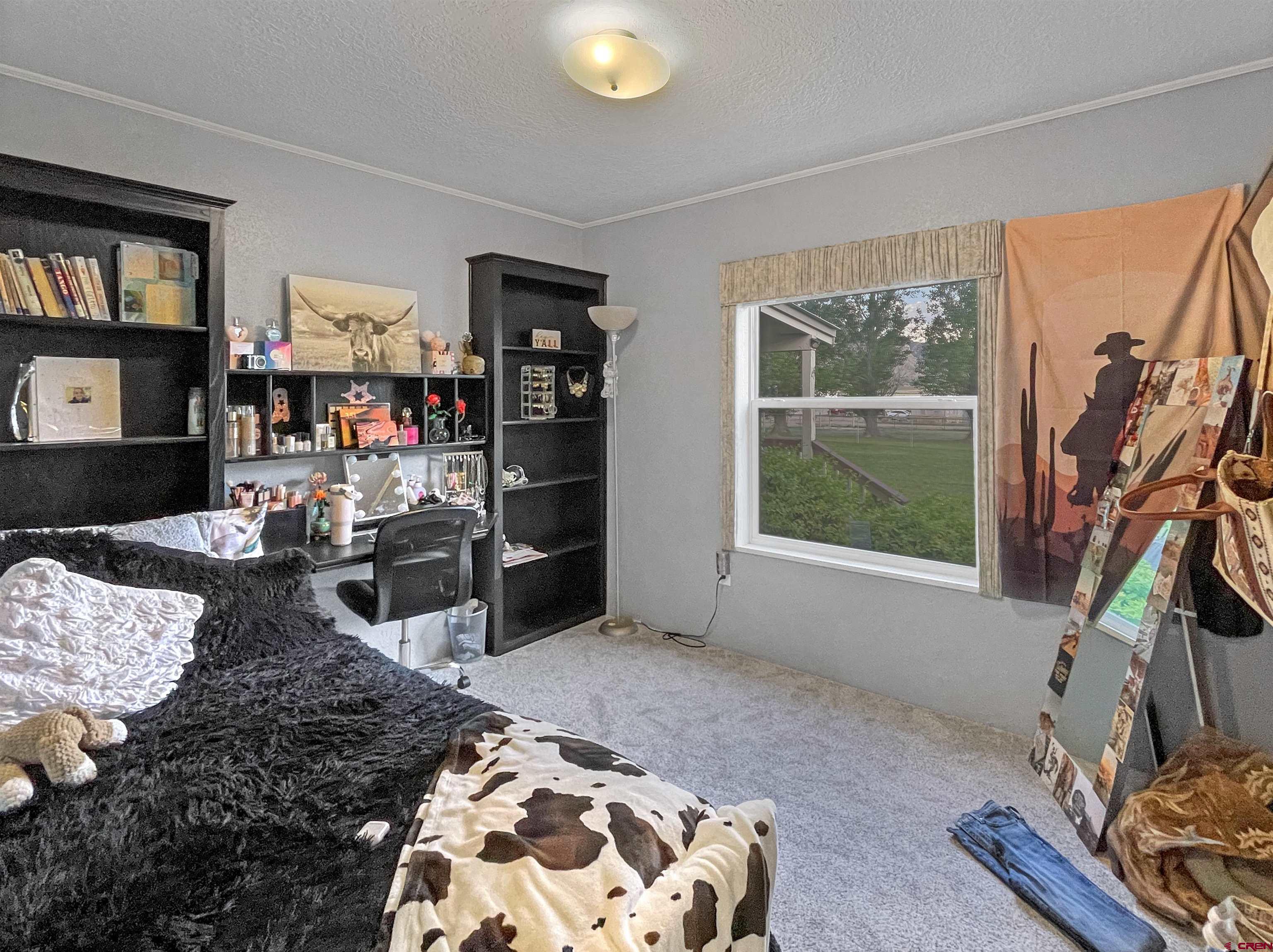 21043 Road C 7 Cortez Co 81321 Cortez, CO 81321 - Photo 22 of 40 a bedroom with furniture and a window