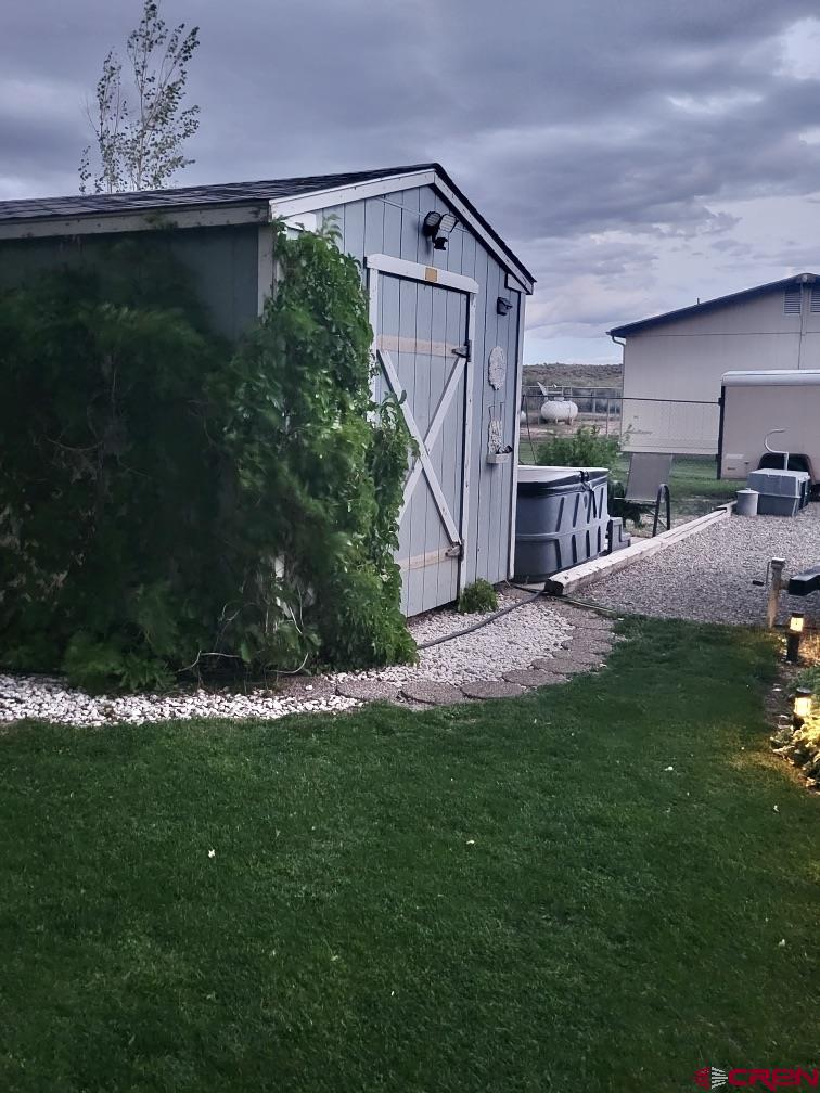 21043 Road C 7 Cortez Co 81321 Cortez, CO 81321 - Photo 25 of 40 a view of backyard with plants and outdoor seating